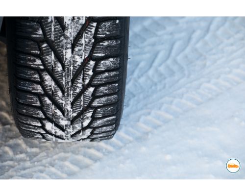 black tyre on snow tyre from above on snowy ground