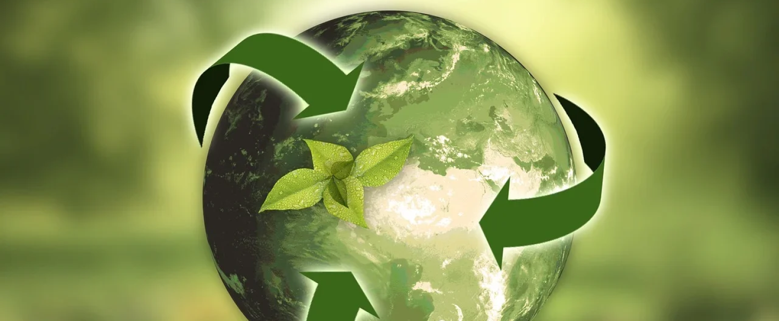 A green planet with a green background. There are also green arrows revolving around the green planet.