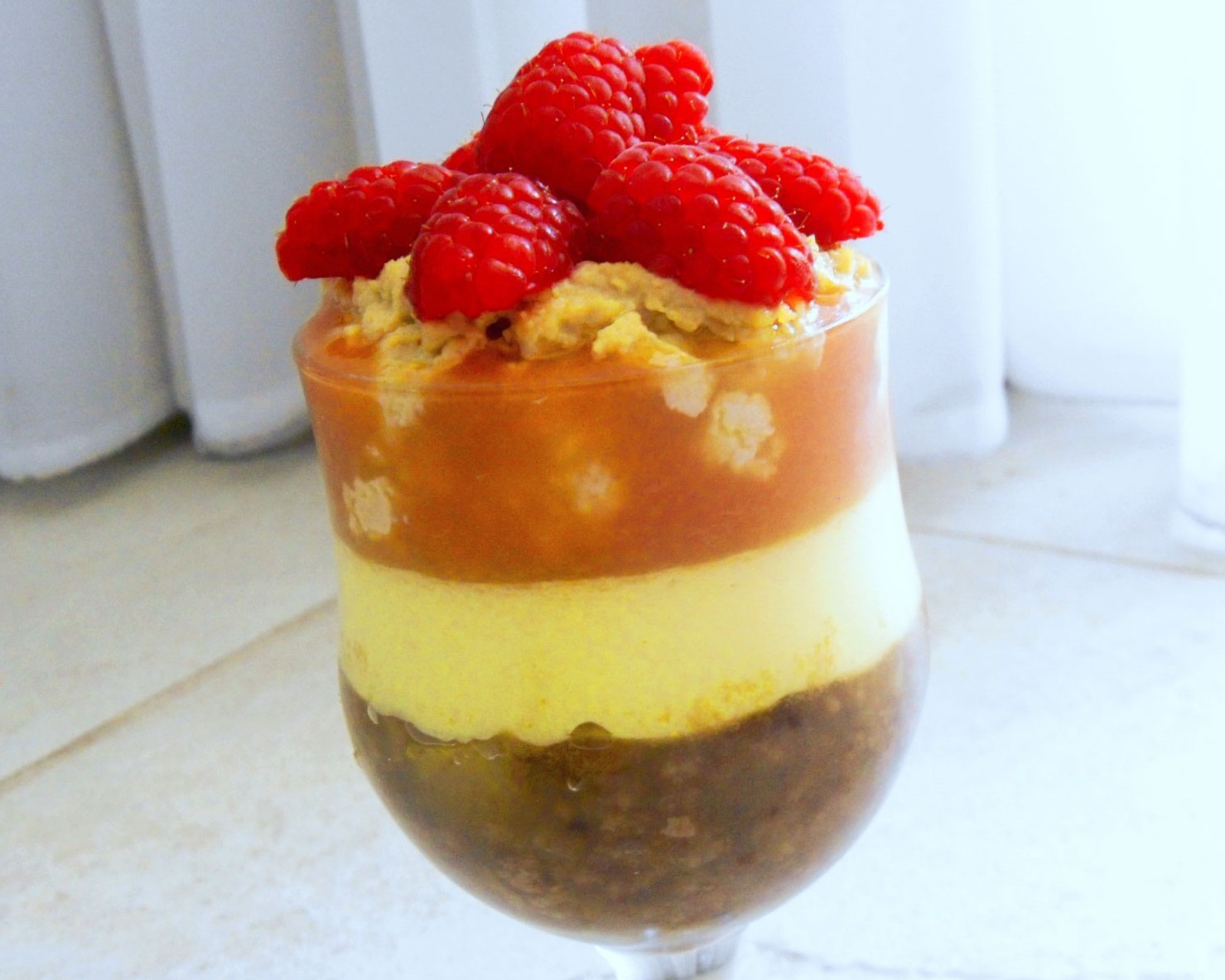Christmas Vegan Trifle Recipe ~ Carob Cherub | The holidays are a time to indulge a little so enjoy this decadent Christmas Trifle. It's a special dessert filled with holiday cheer. Creamy layers of vegan custard are paired with crumbly cookies and fresh fruit. Your guests will be impressed with this creamy homemade dessert.