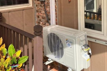 Ductless mini split condensor outside the home