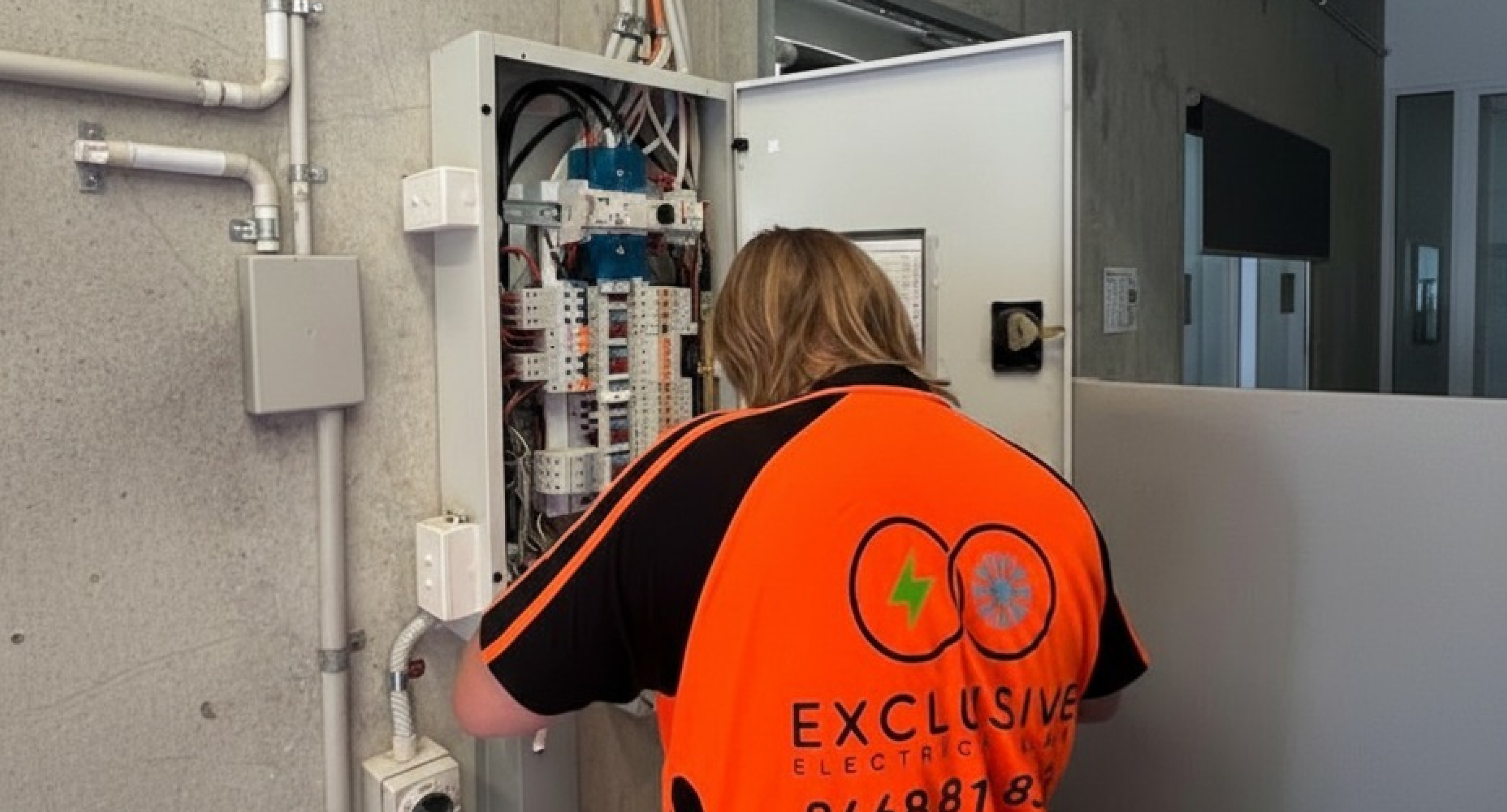 Exclusive Electrical & Air electricians performing professional switchboard upgrades, electrical repairs, and safety checks. Includes modern switchboard installations, rewiring, and night-time emergency electrical service in Brisbane.