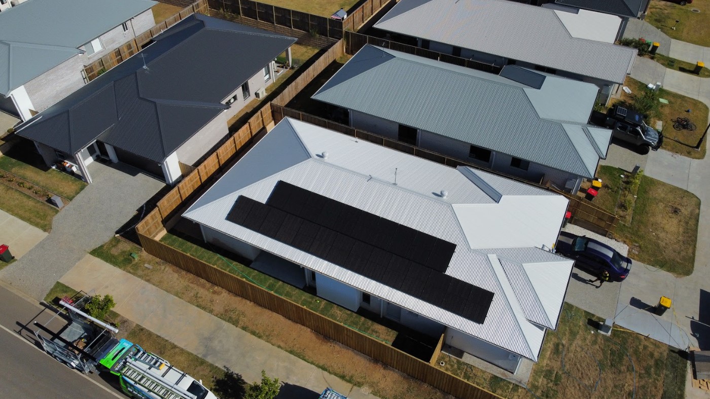 Exclusive Electrical & Air completed a professional residential solar panel installation on a modern home with a white roof, delivering clean energy solutions and improved energy efficiency.