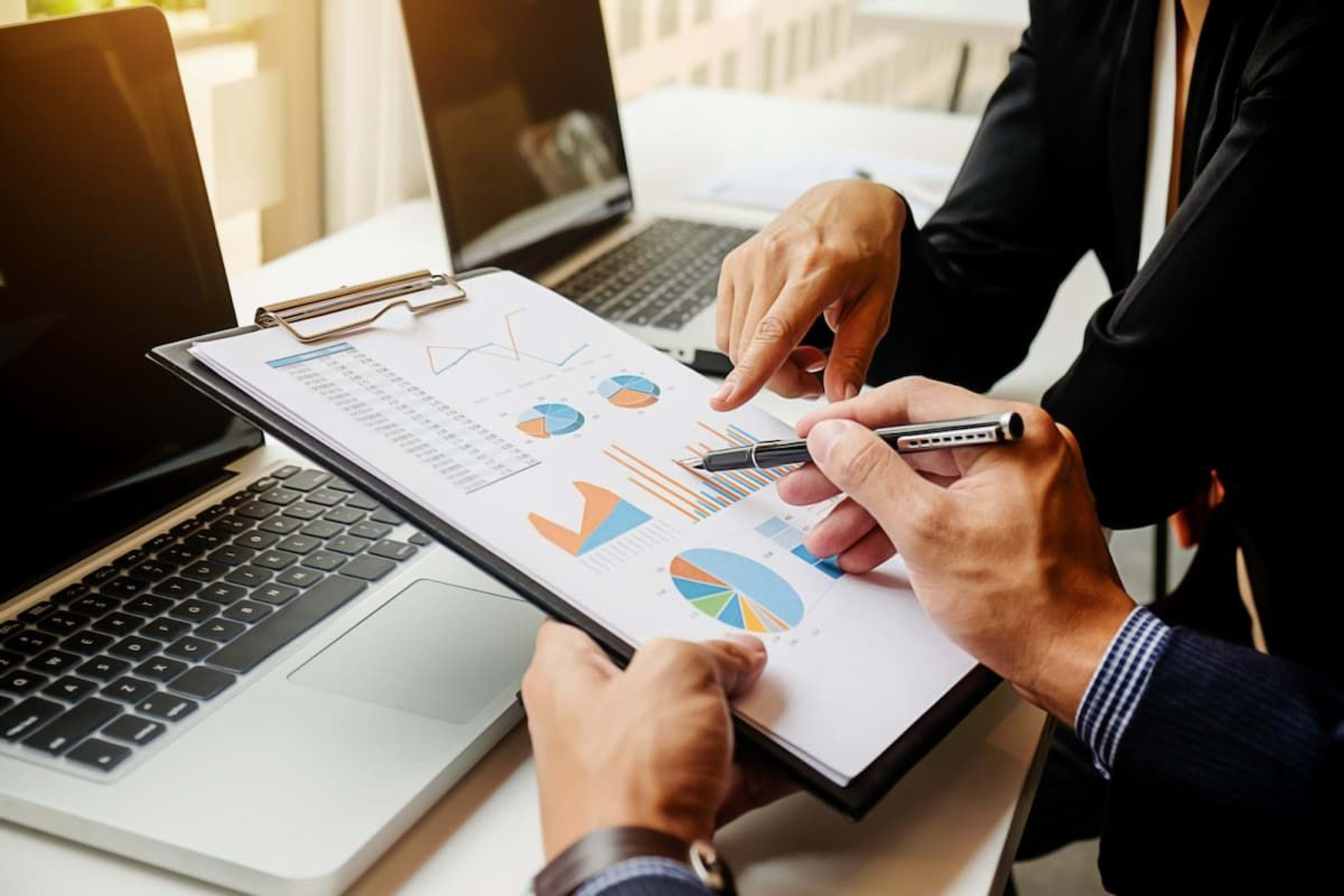 businessmen-discussing-cash-flow-report.jpg