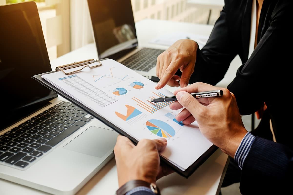 businessmen-discussing-cash-flow-report.jpg