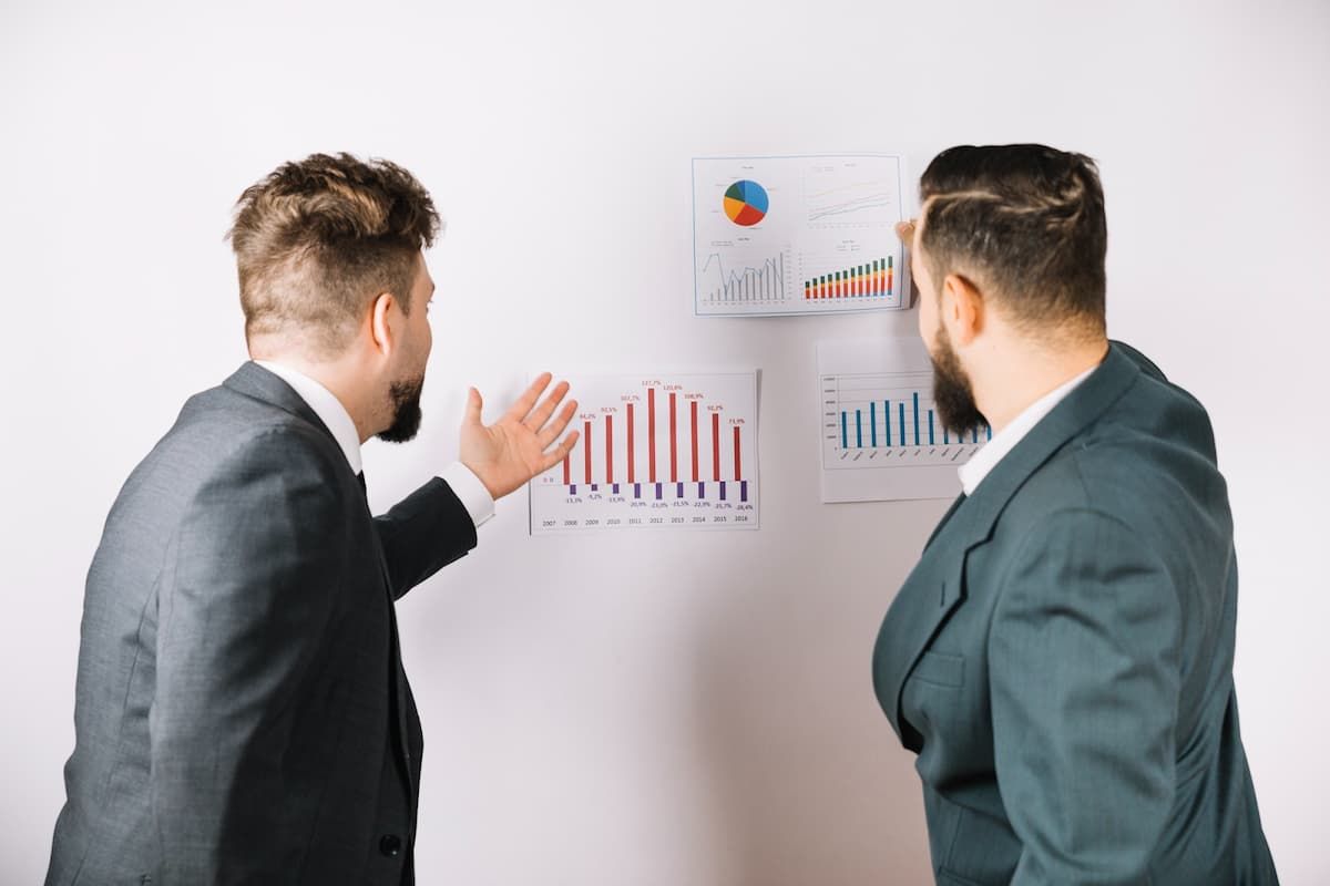 businessmen-comparing-financial-reports.jpg
