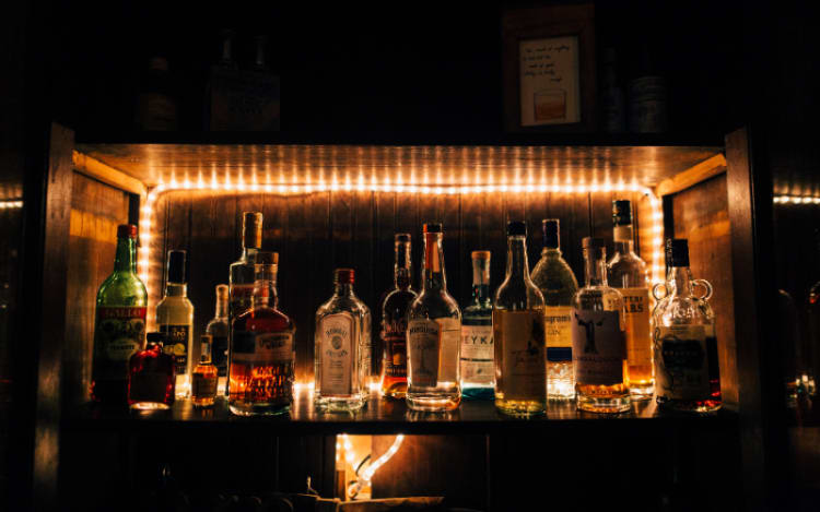 Whisky bottles being stored on a shelf