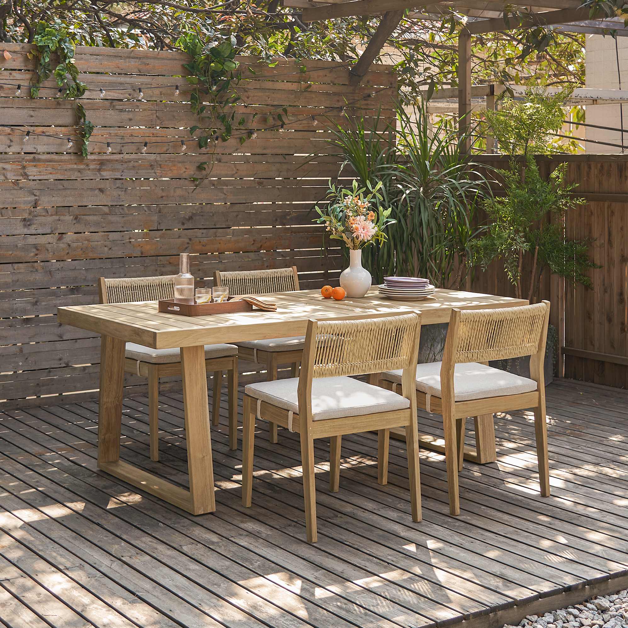 Rio Outdoor Teak Dining Table, 63" and 4 Chairs (Treated Version) lifestyle