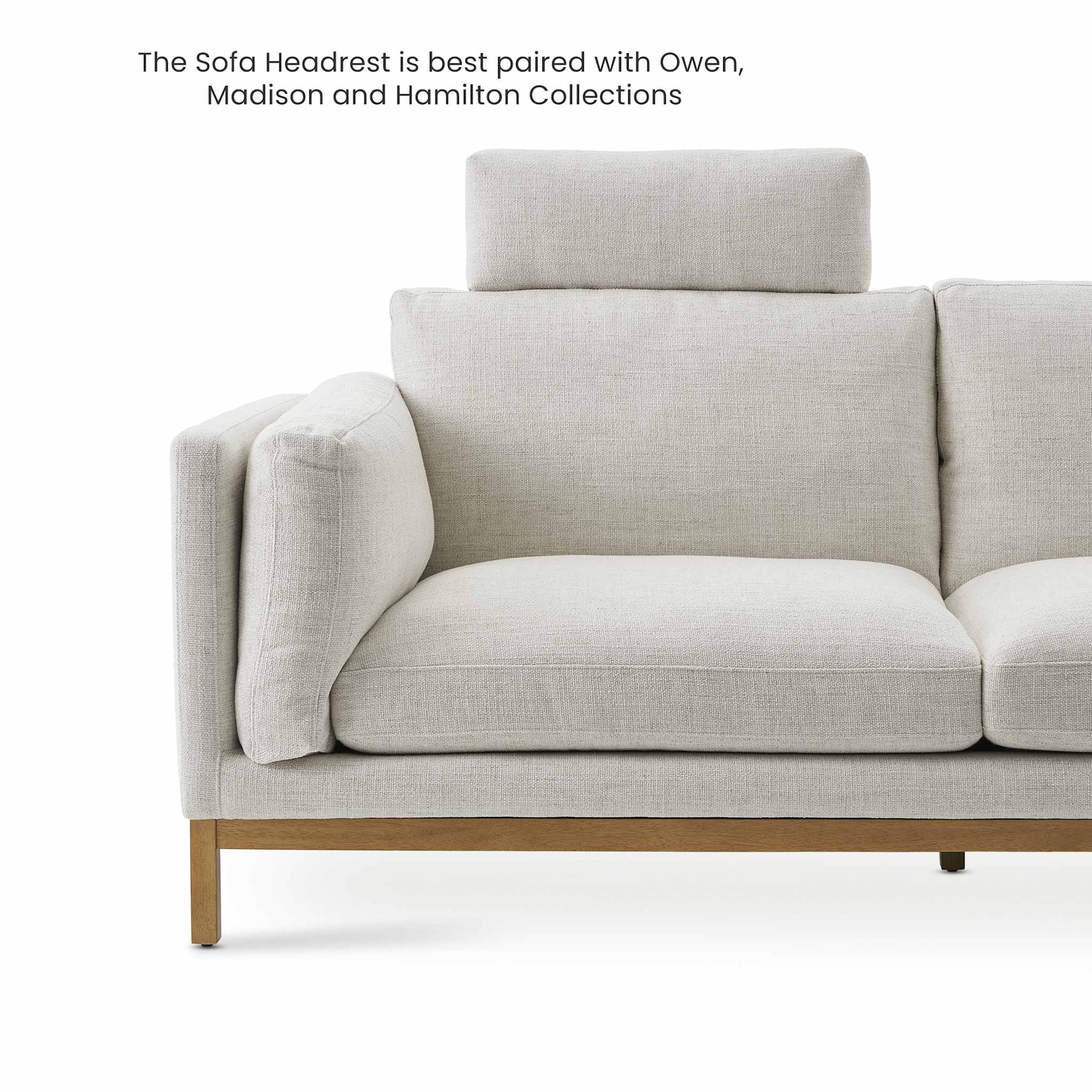 A light grey textured sofa headrest.