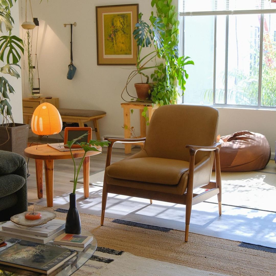 A leather armchair placed in a living room.