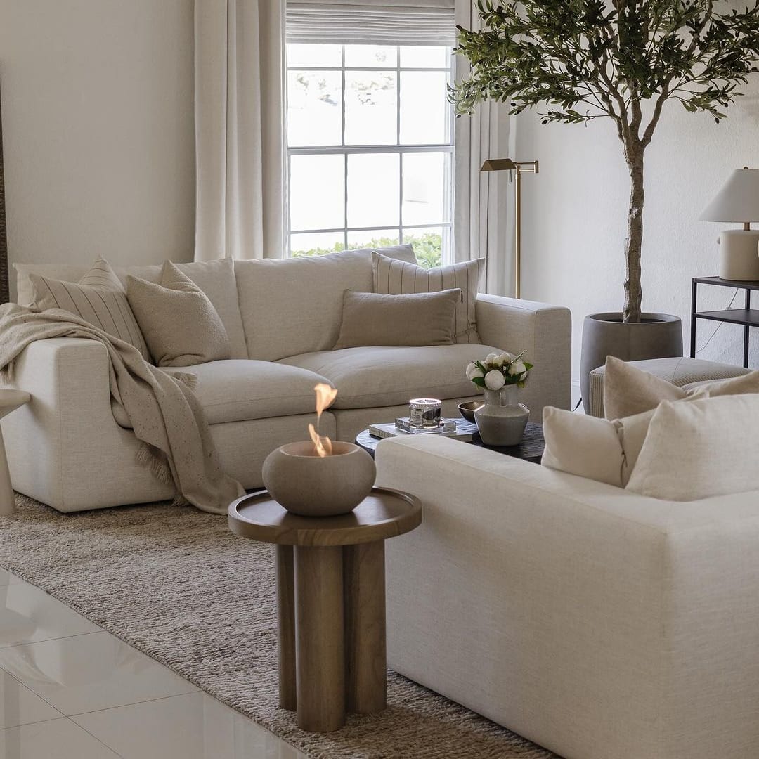 Two identical white sofas facing each other in a living room.