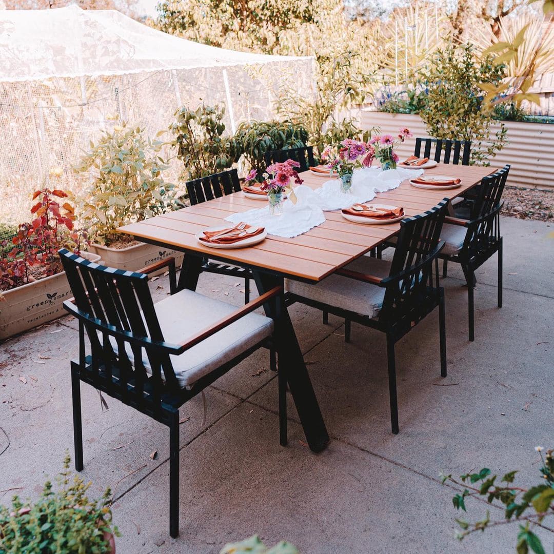 A resin wood table top with matching dining chairs.