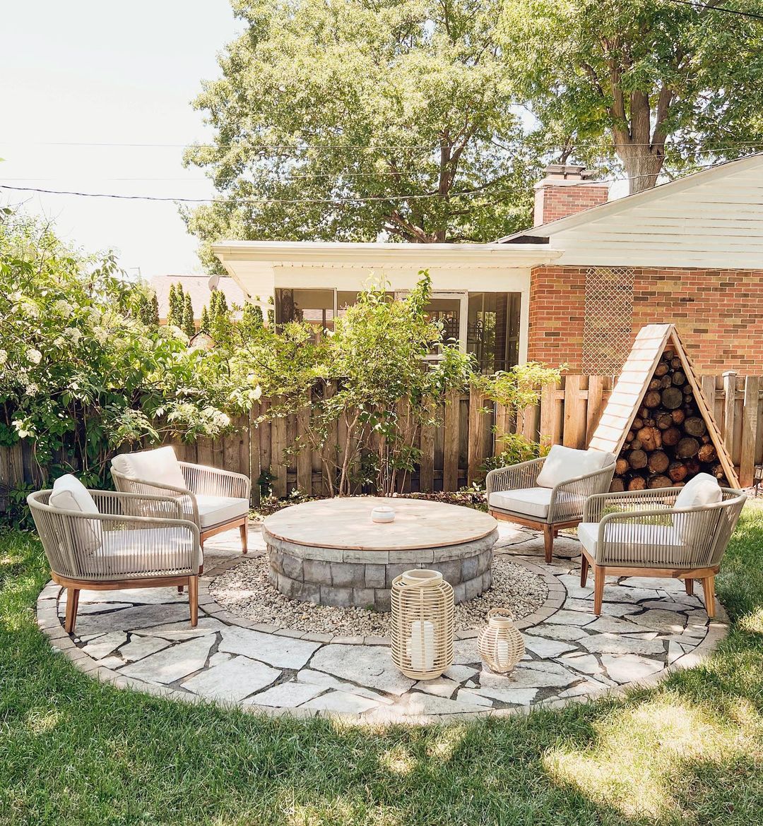 4 lounge chairs surrounding an outdoor firepit.