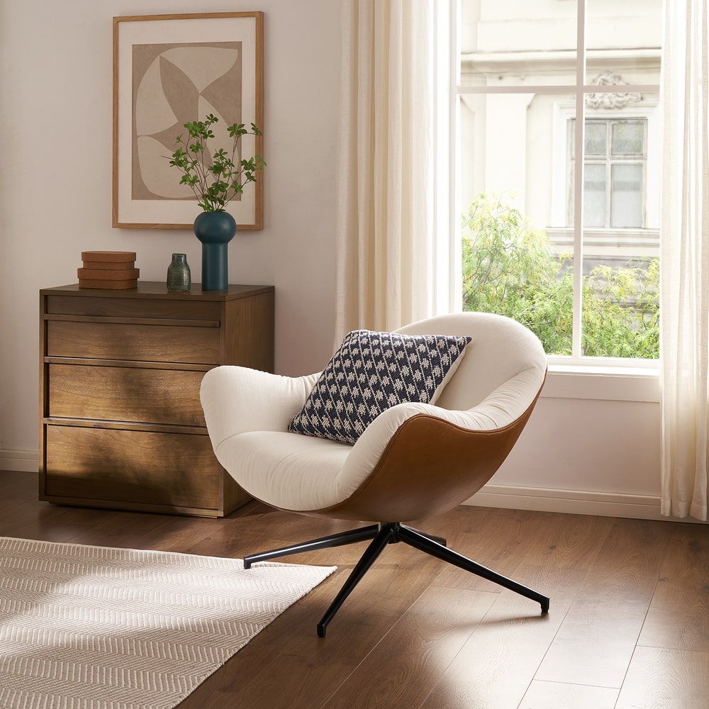 A performance fabric swivel armchair with a top grain leather base.