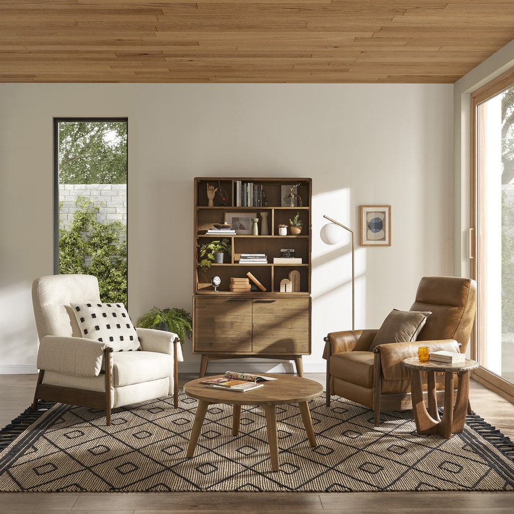 One performance fabric recliner and a matching leather recliner in a living room.