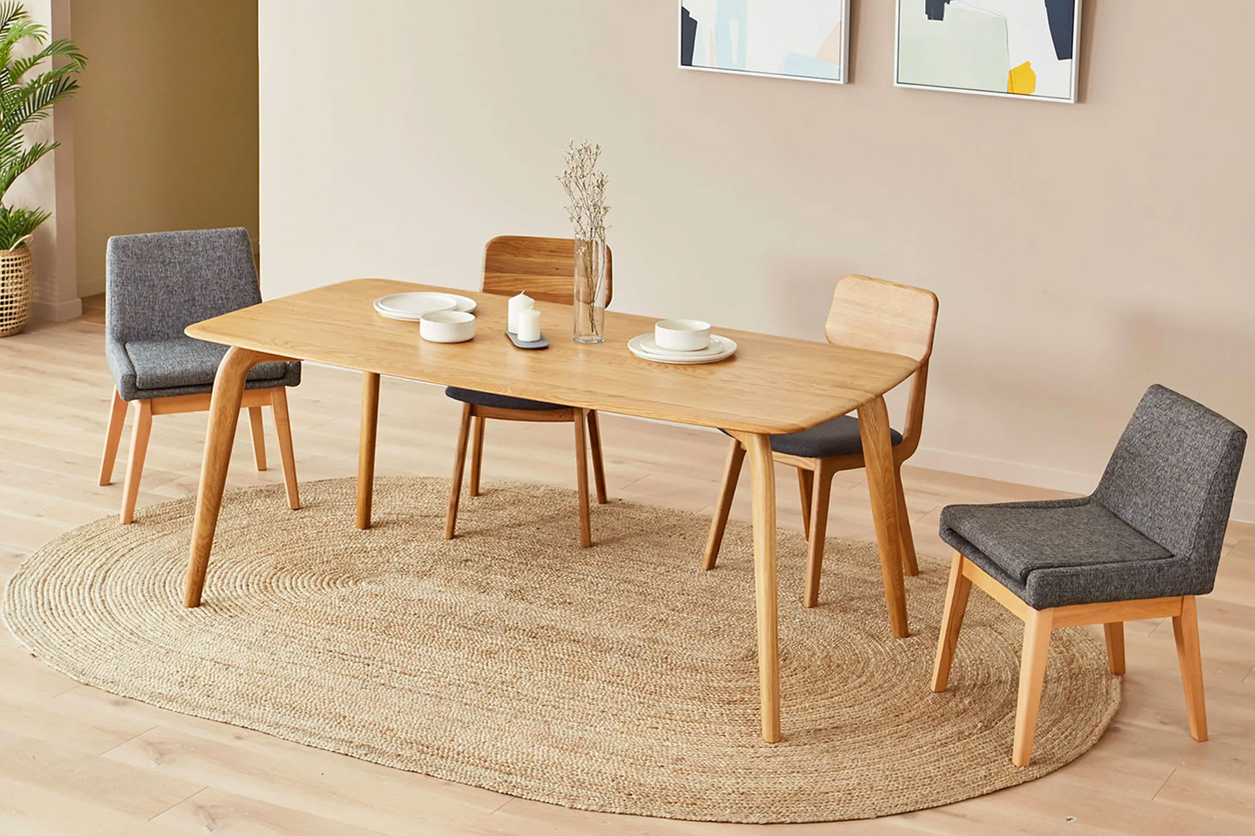 Bright Scandi dining space with wood dining table and chairs