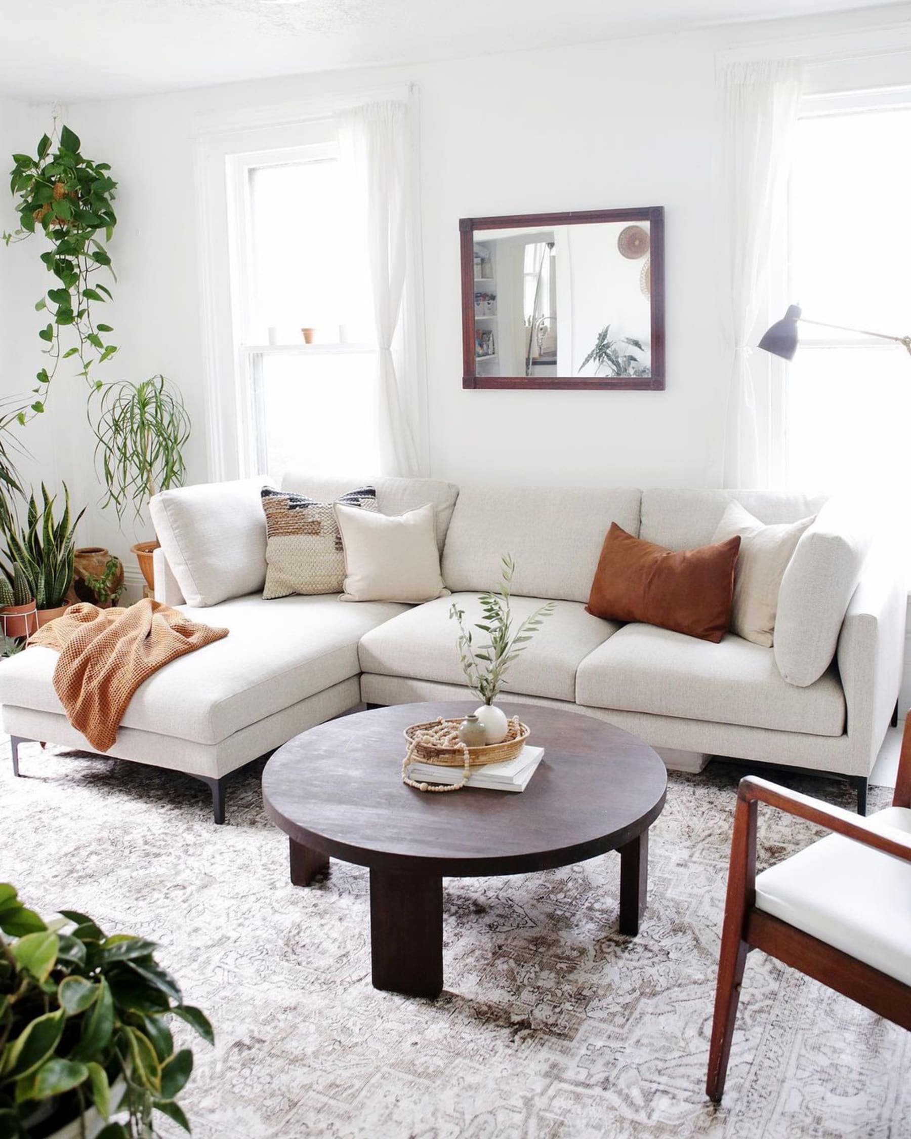 Bright and airy cosy living room styled with house plants