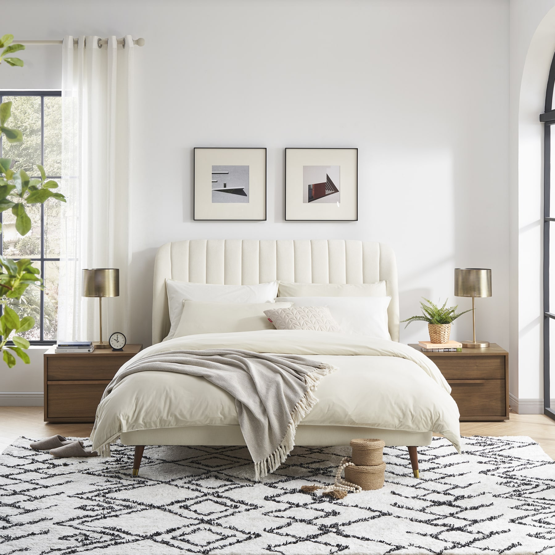 Beige bedsheets styled in a cosy, modern bedroom