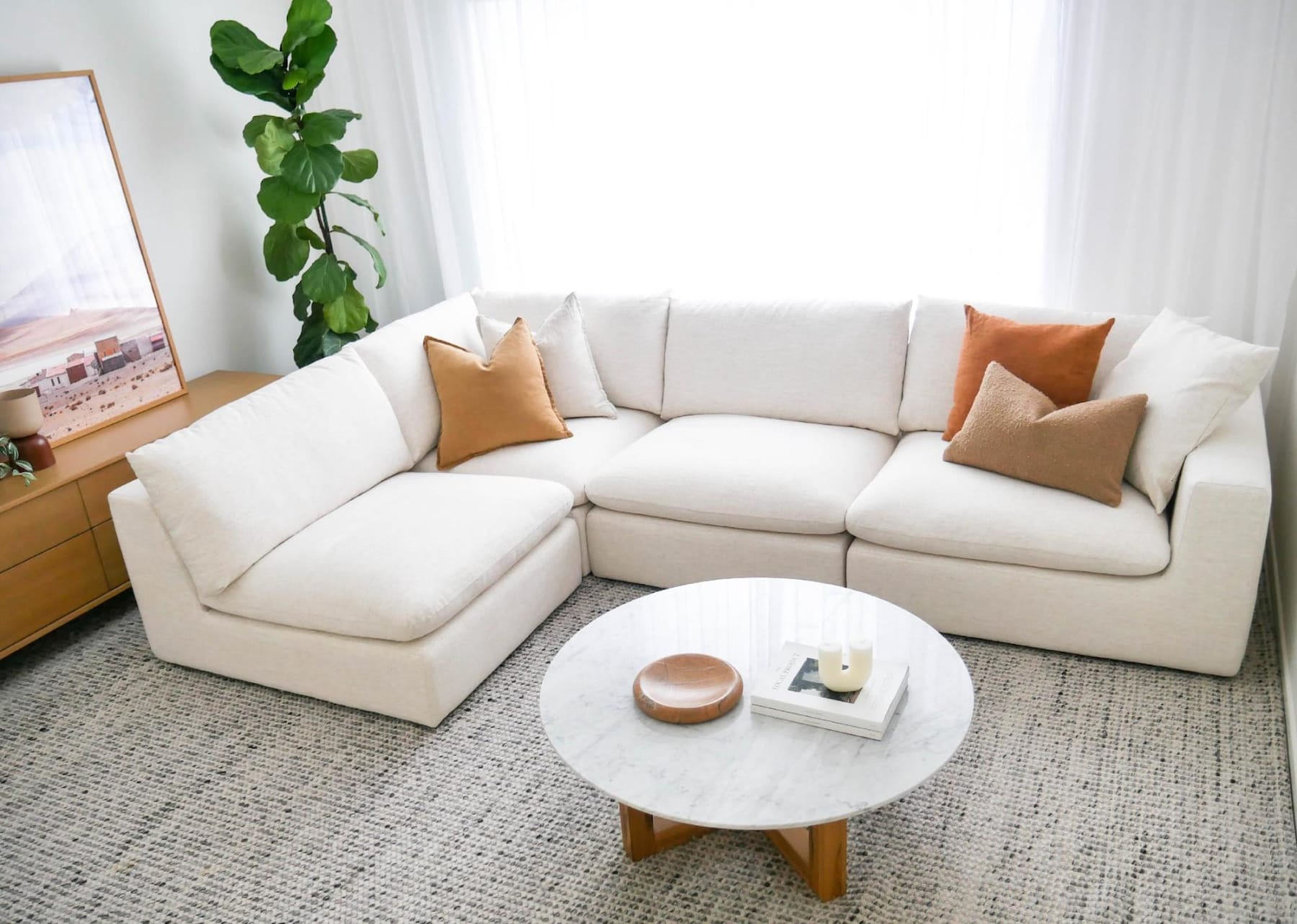 Beige sectional sofa in a neutral colour-themed living room