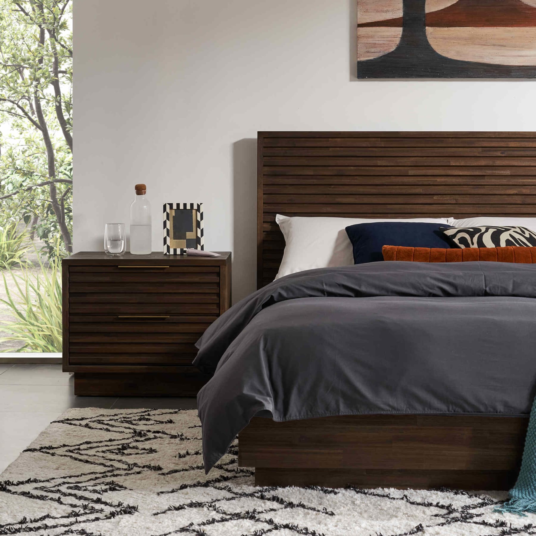 Bedside table and bedframe with wooden slats for a mid-century modern design