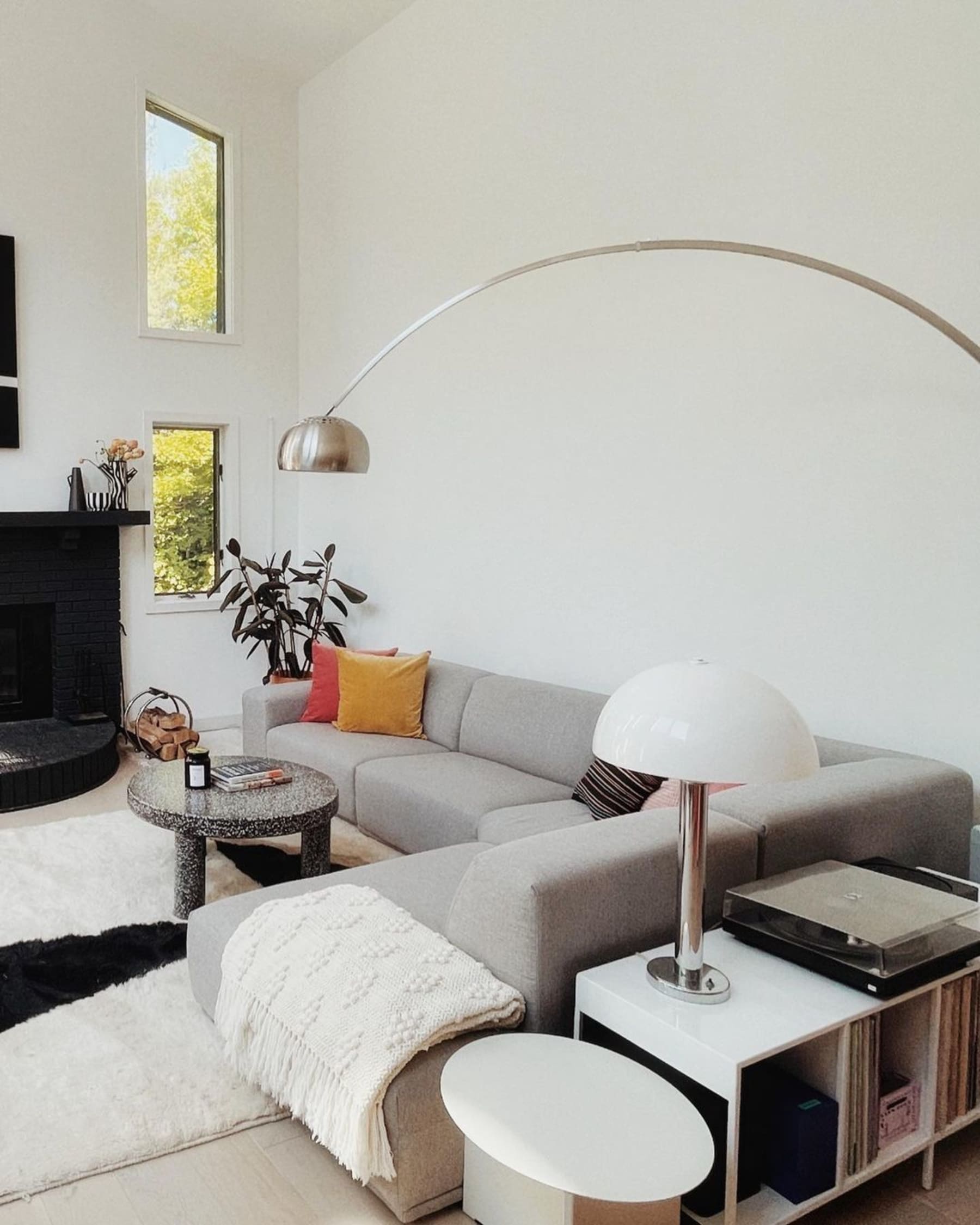 A gray extended sectional chaise sofa with accent pillows.