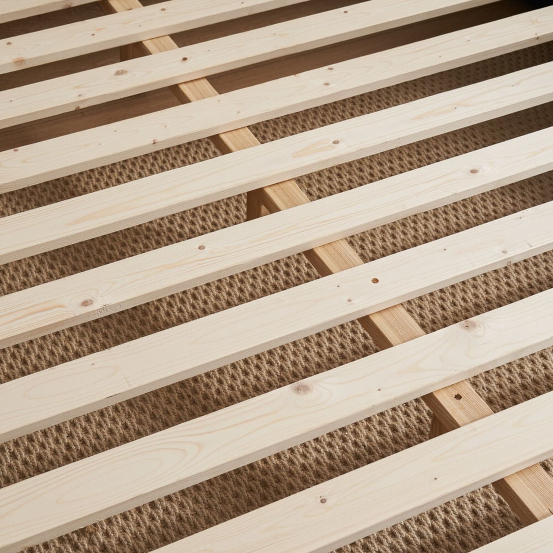 A close up shot of wooden bed slats