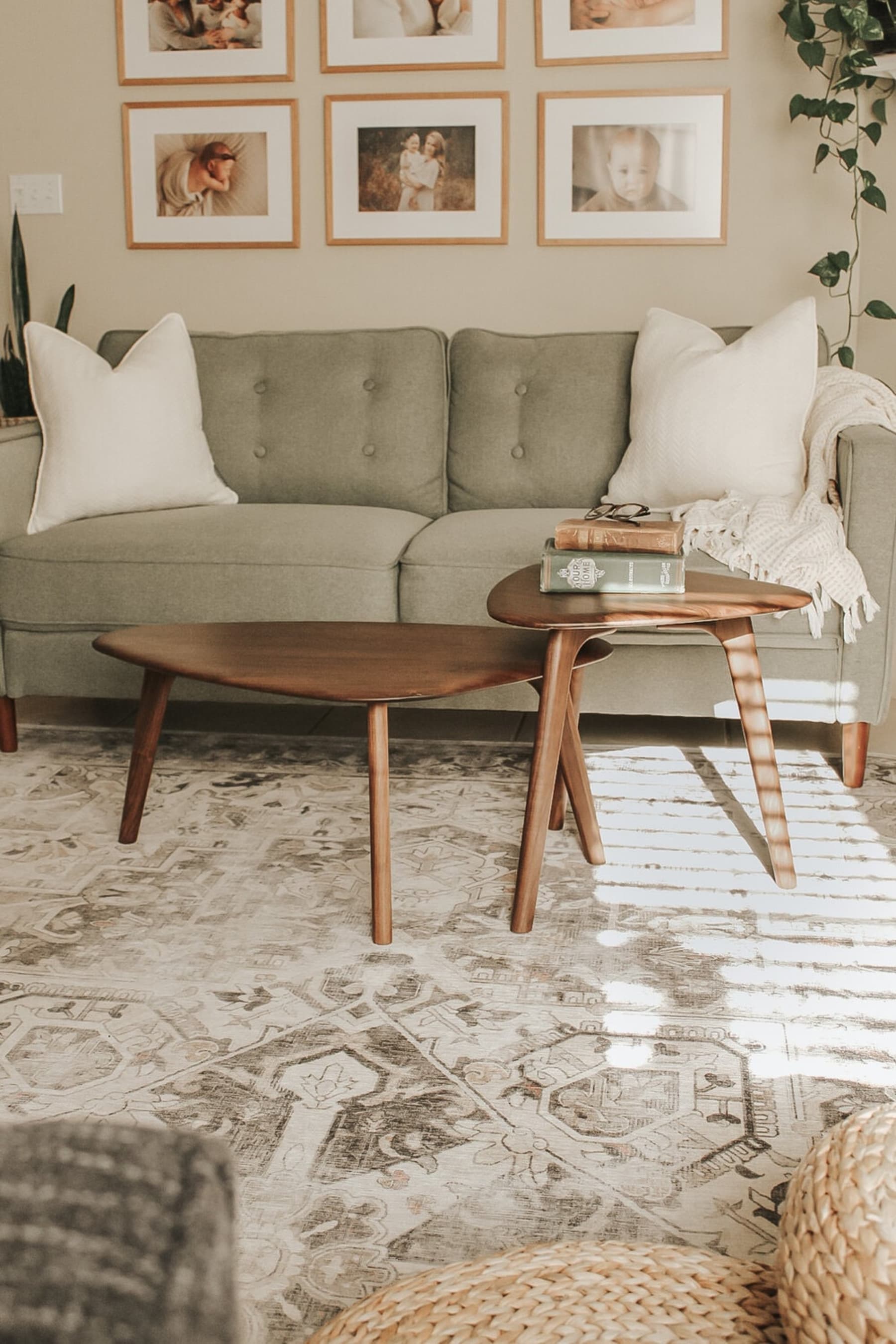 A nested coffee table with a walnut finish.