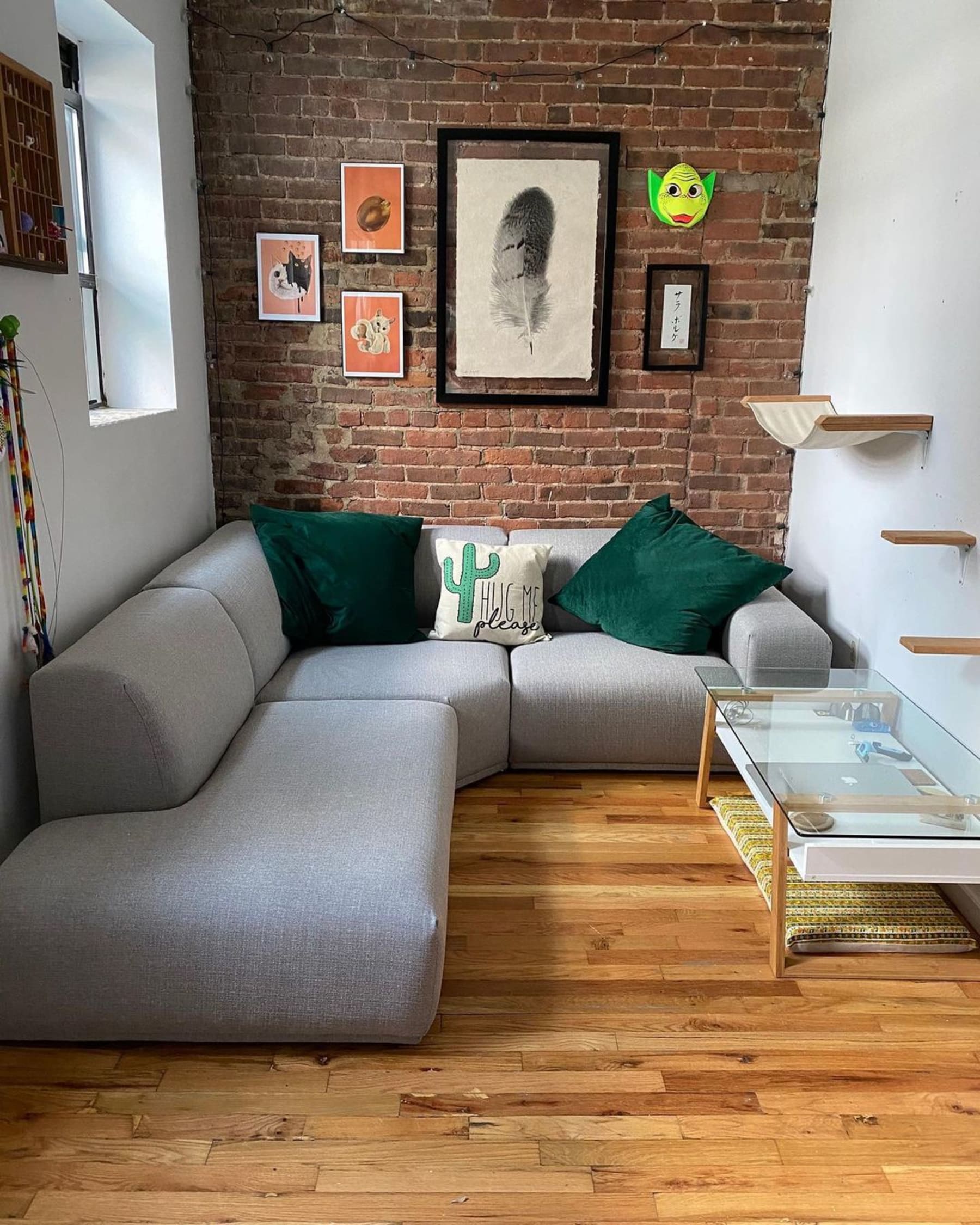 A gray modular sofa in a small living room space.