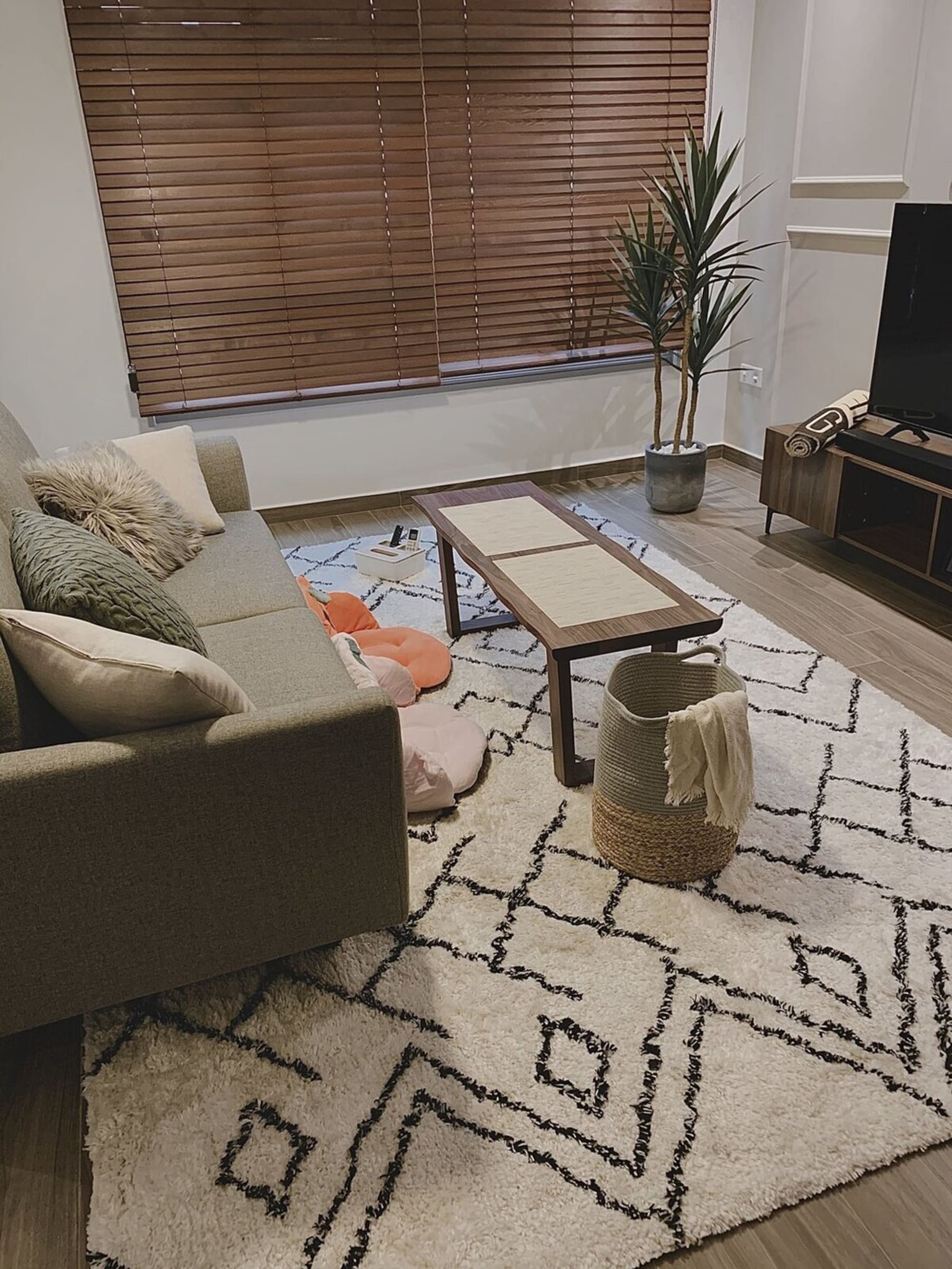 A gray cotton runner below a coffee table.