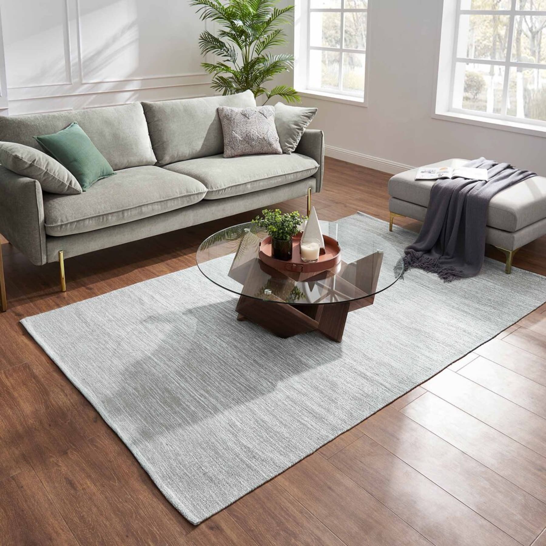 A gray cotton runner below a coffee table.