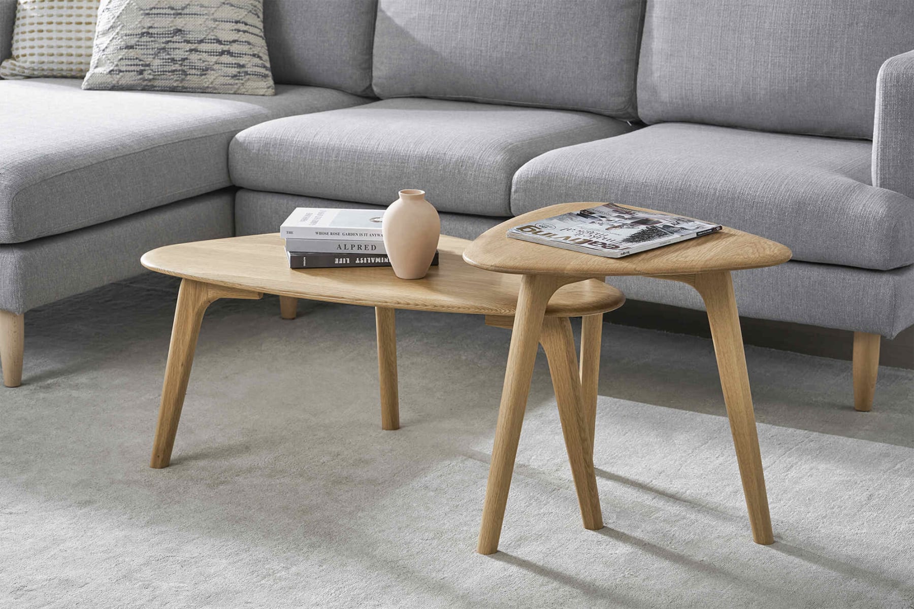 Two tringular nested coffee tables