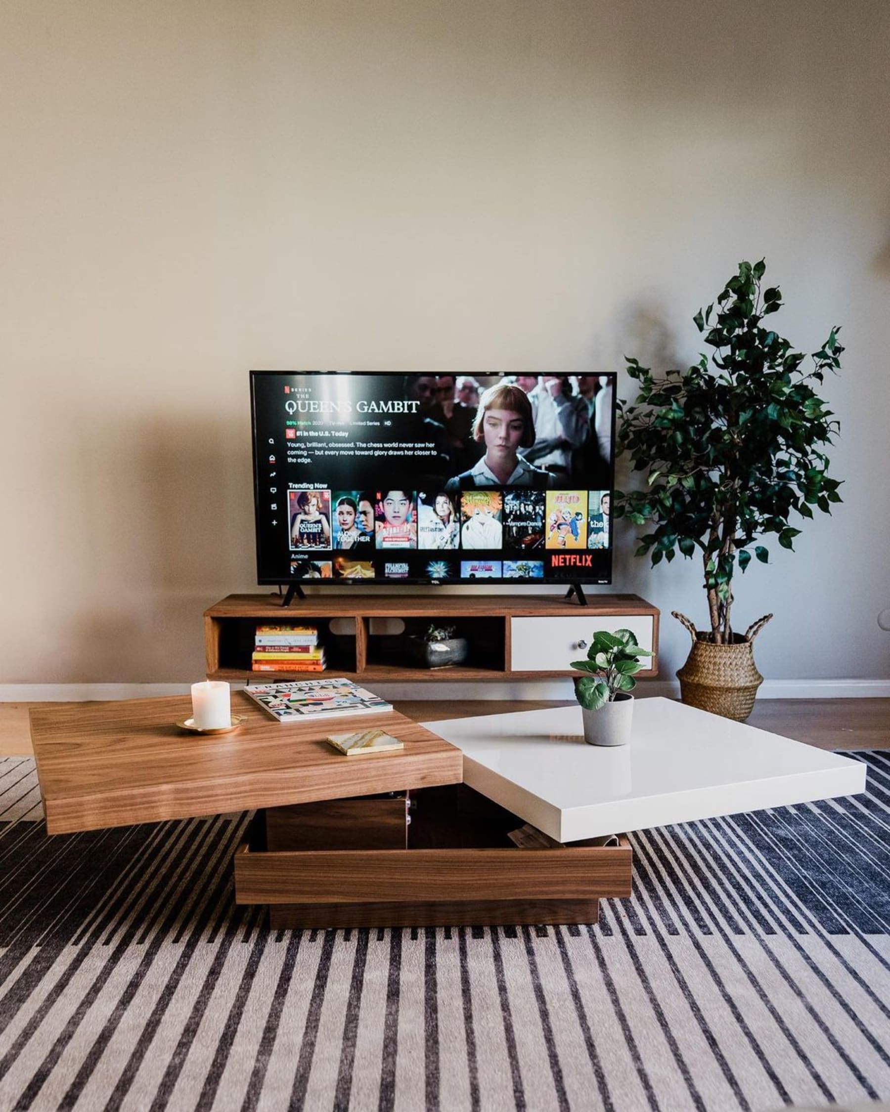 Modern coffee table with two tops that swivels out