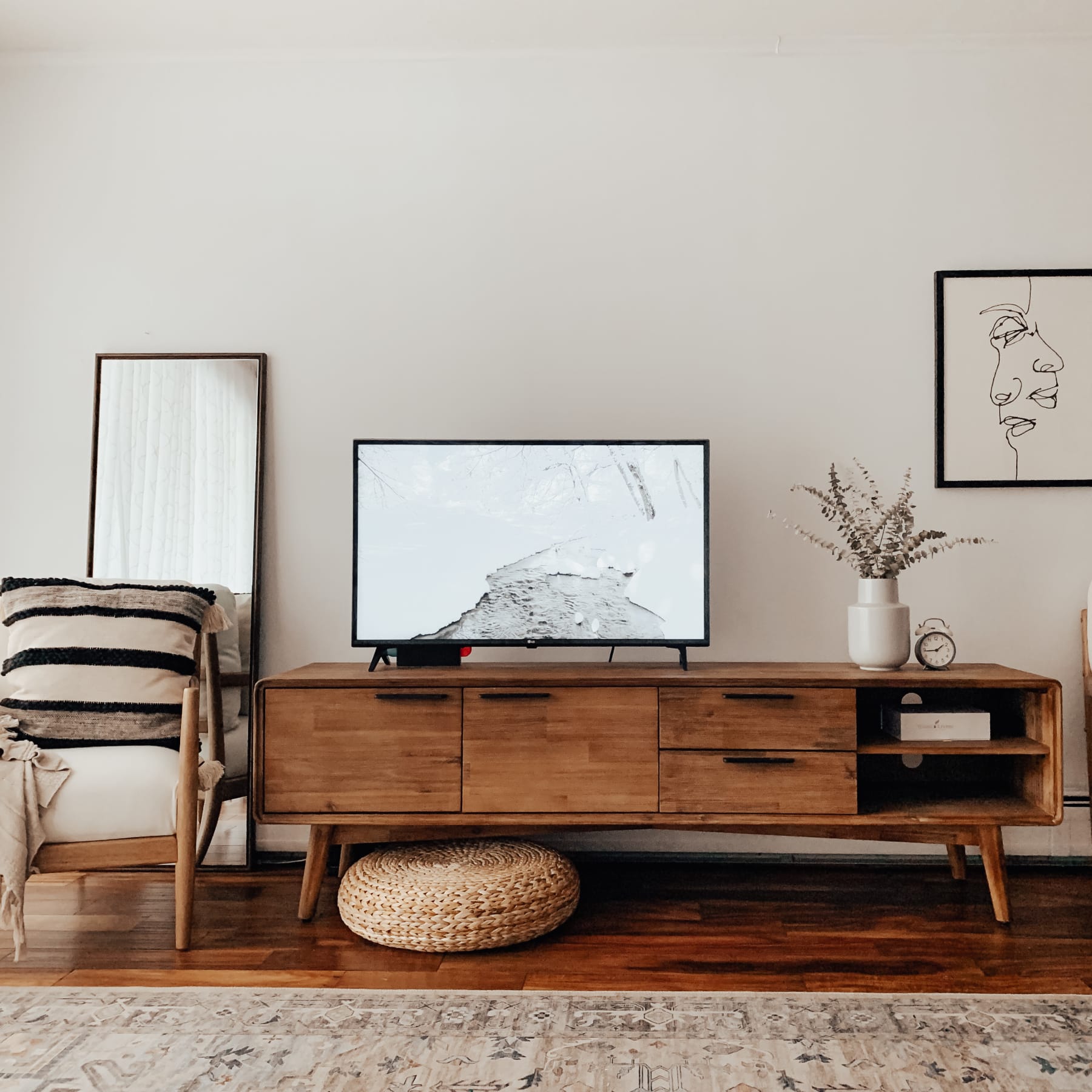 Wooden TV stand with multiple storage compartments and drawers