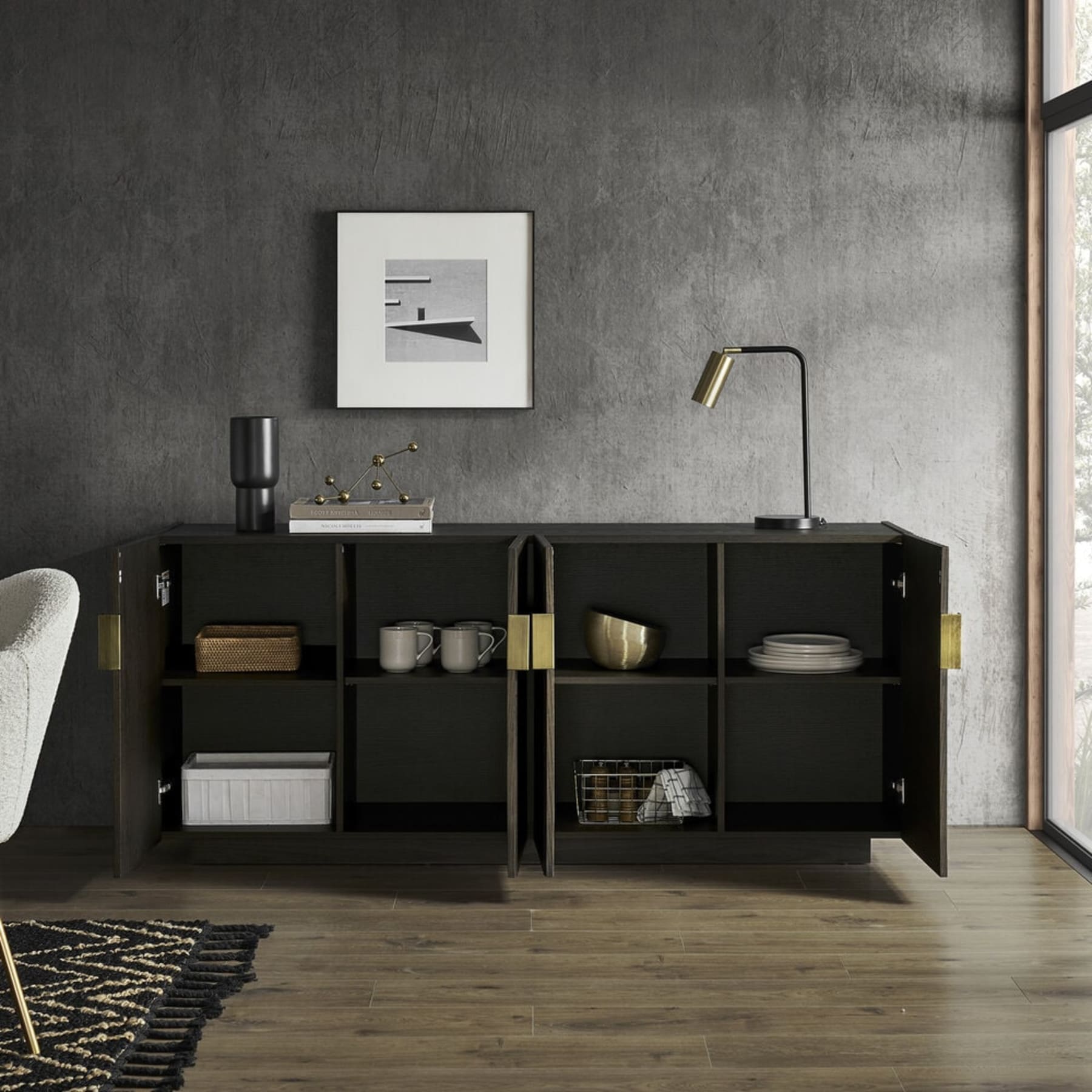 A sideboard with open doors that reveal tableware kept neatly inside.