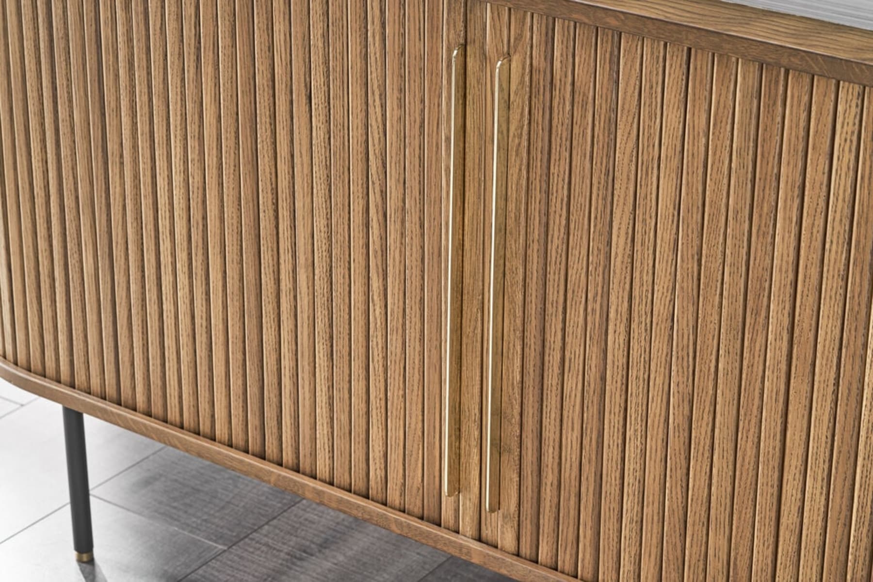 A close up shot of a sideboard with tambour doors.