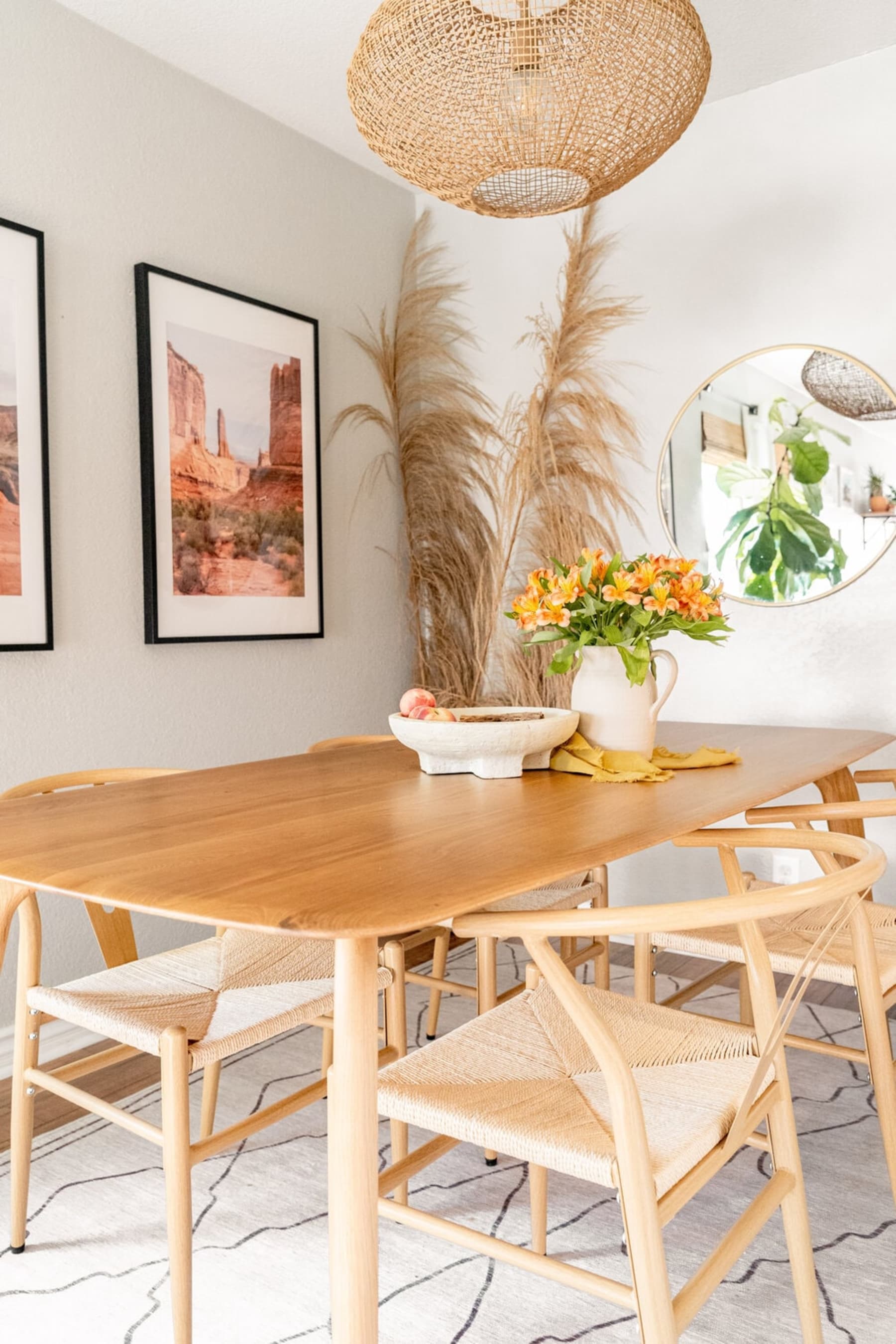 A dining table in oak with matching dining chairs.