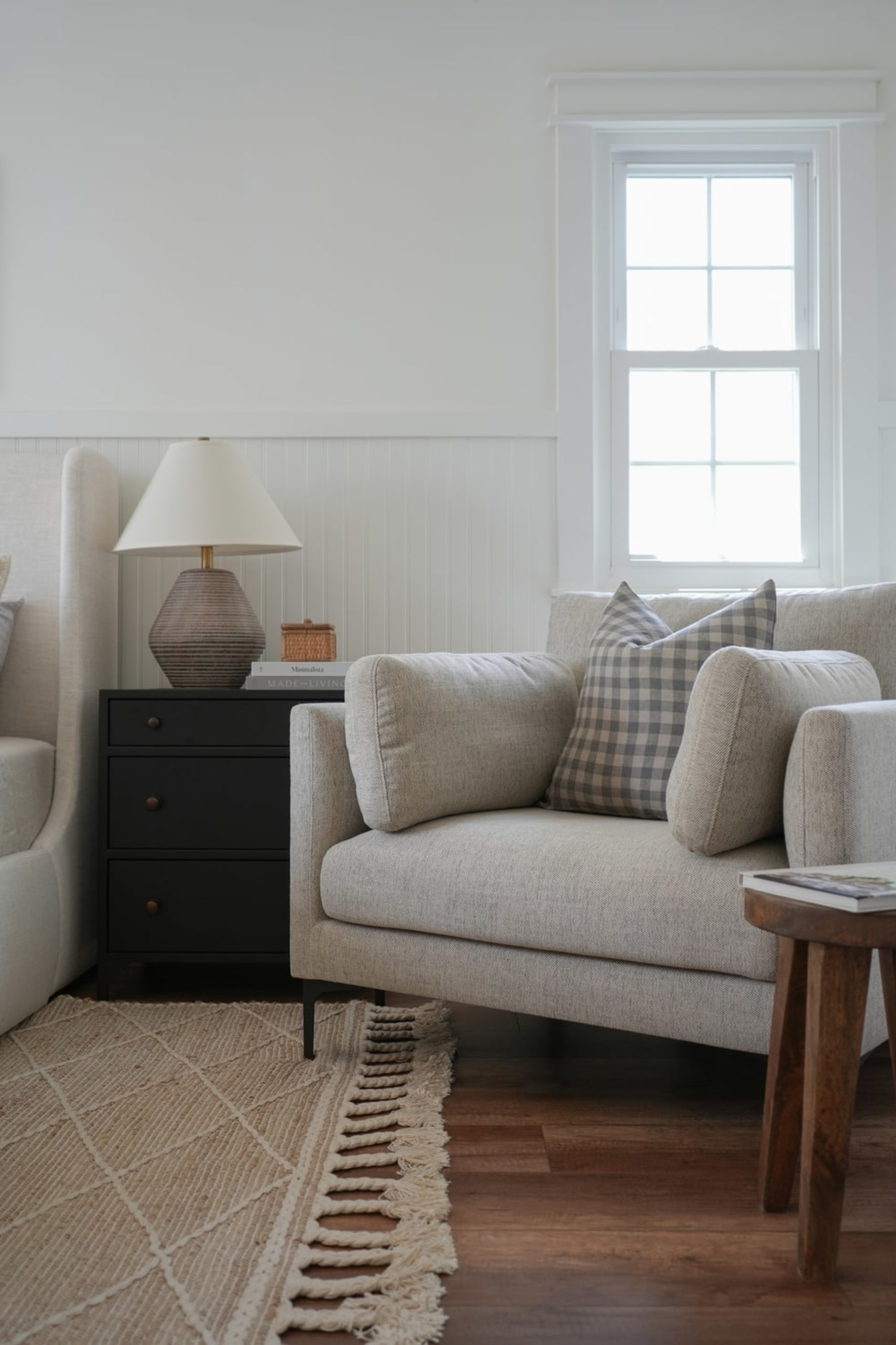 A fabric armchair with legs that raise it off the ground.