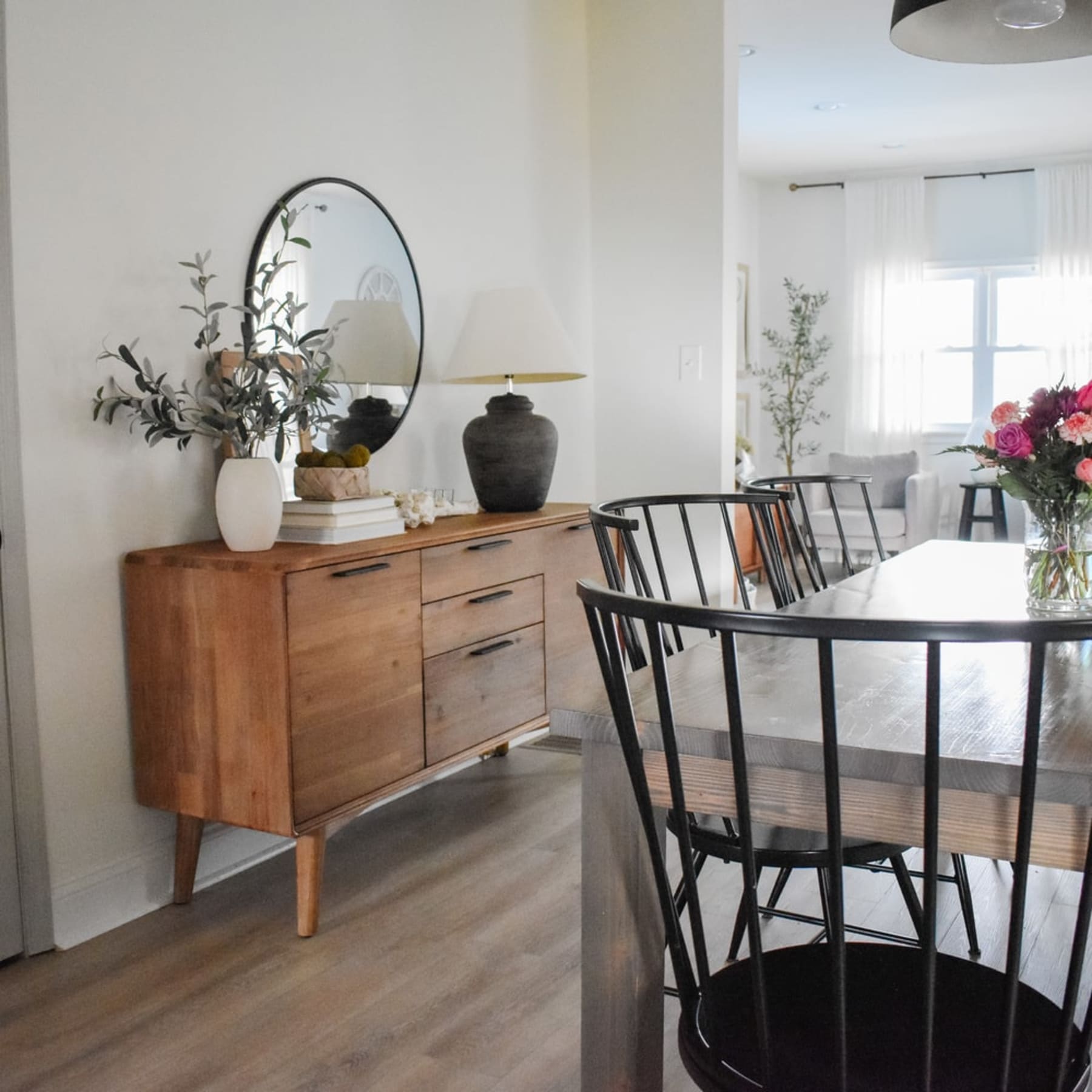 A wooden sideboard with plenty of storage cabinets and drawers.