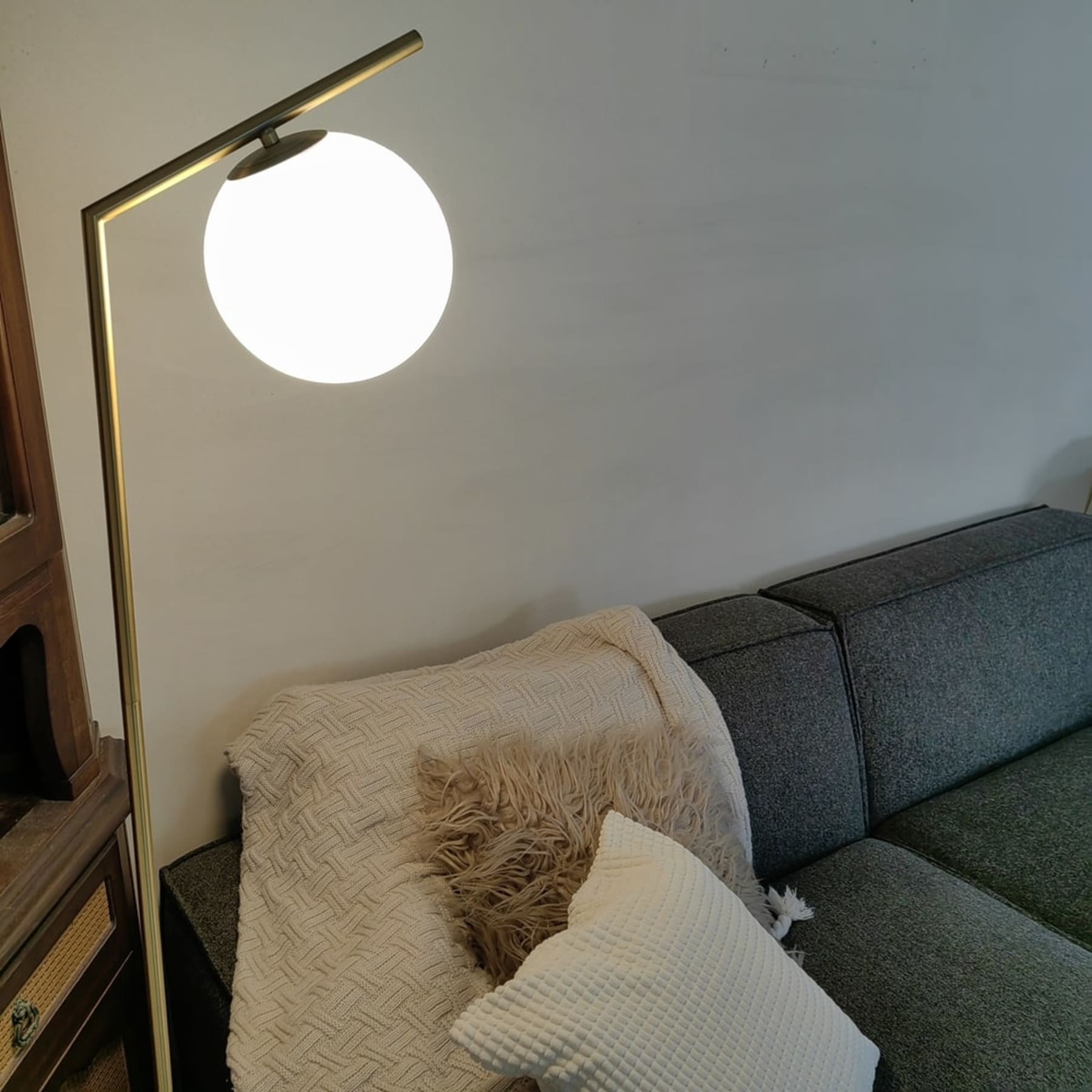 A marble table lamp with a glass lamp shade.