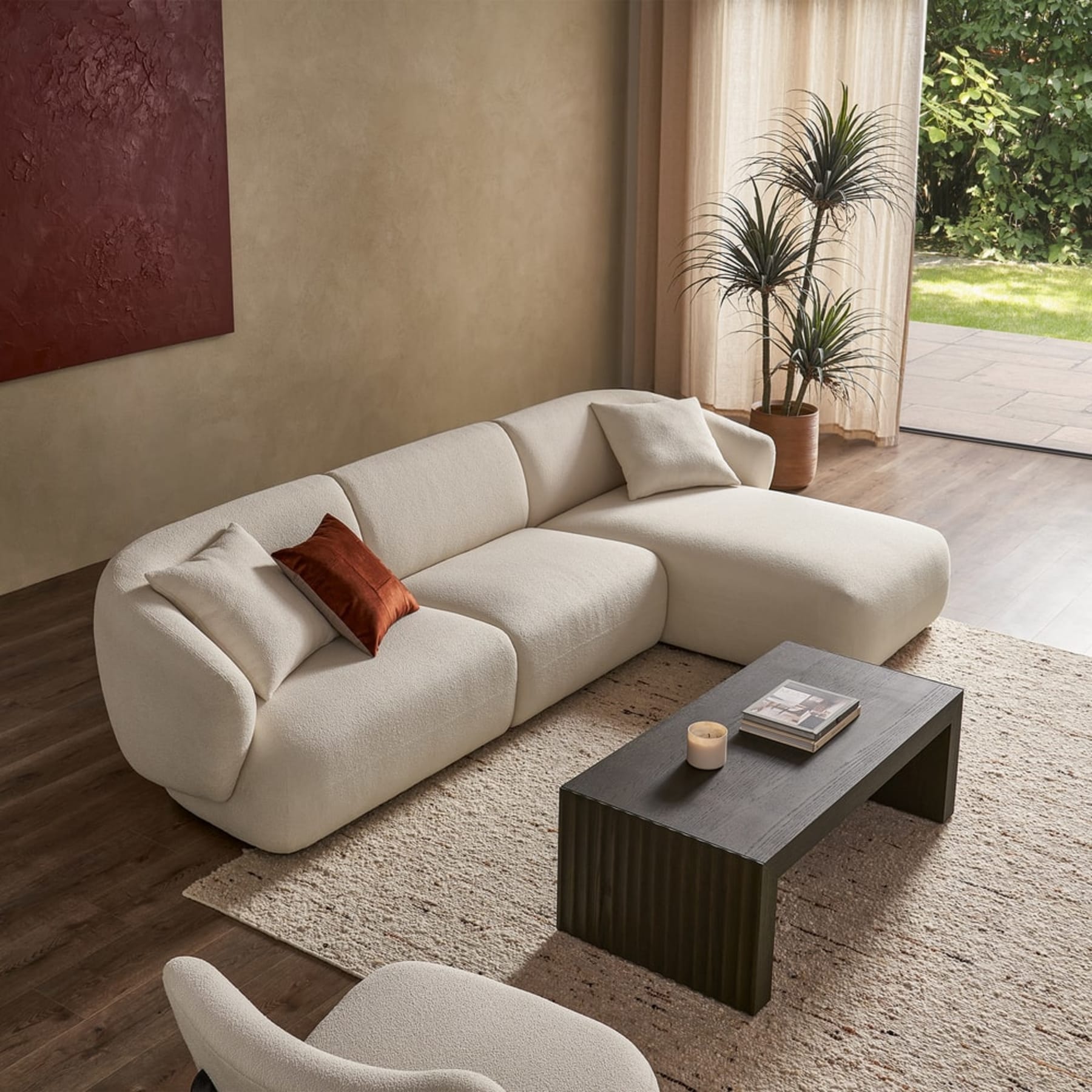 A right-facing chaise sectional sofa with a black coffee table.