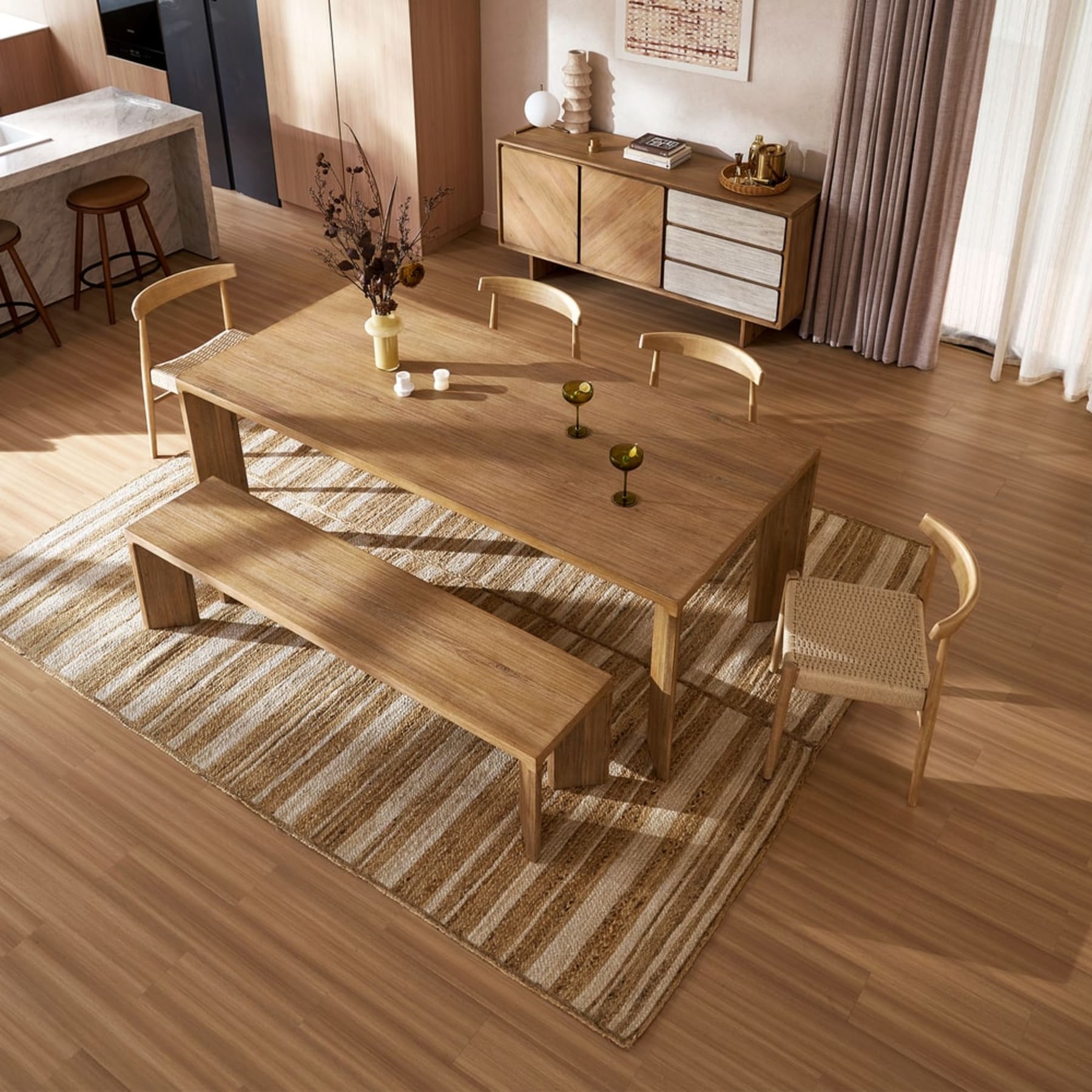 A marble dining table with matching leather dining chairs.