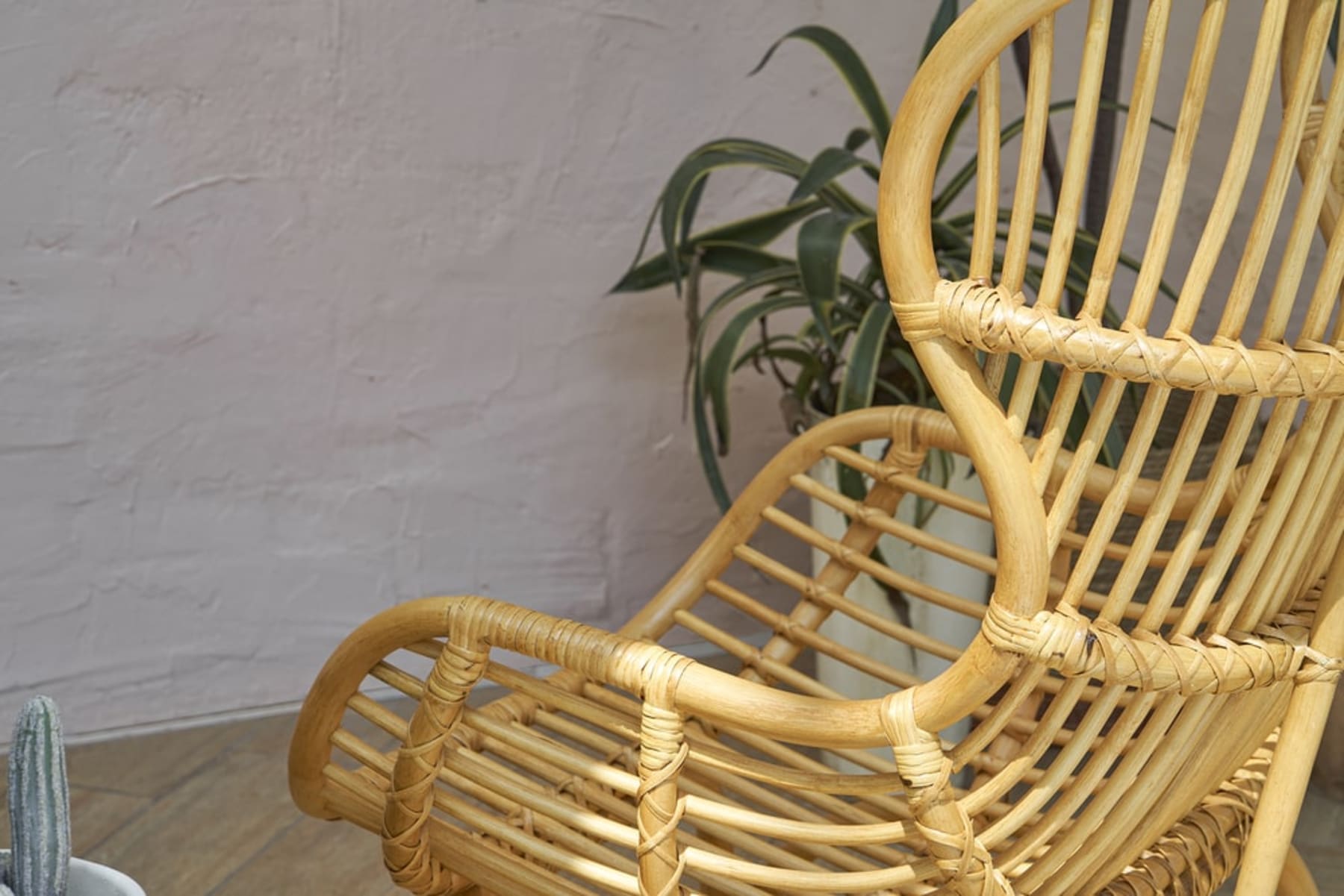 A close-up shot of a rattan armchair.