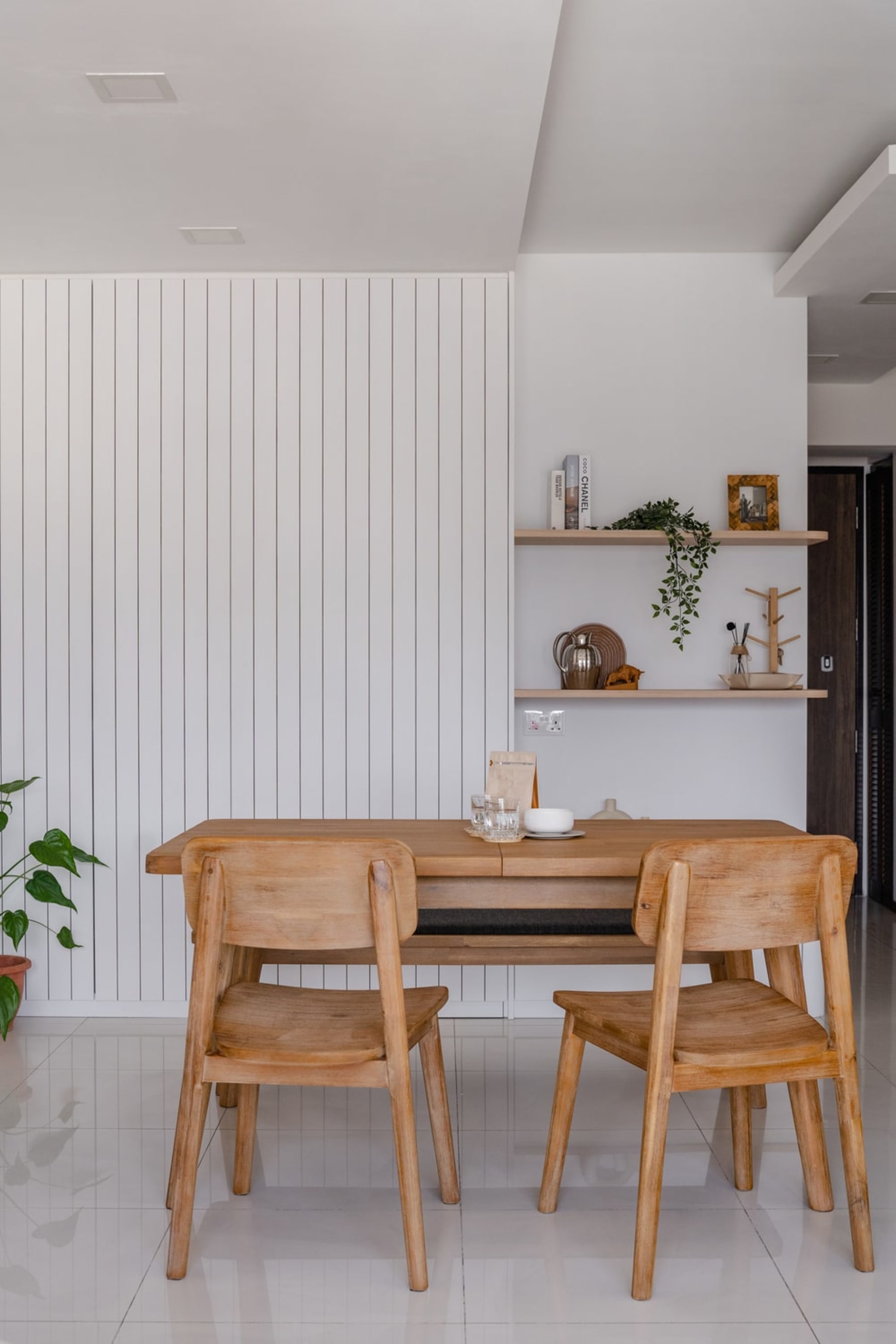 An extendable dining table and matching chairs.