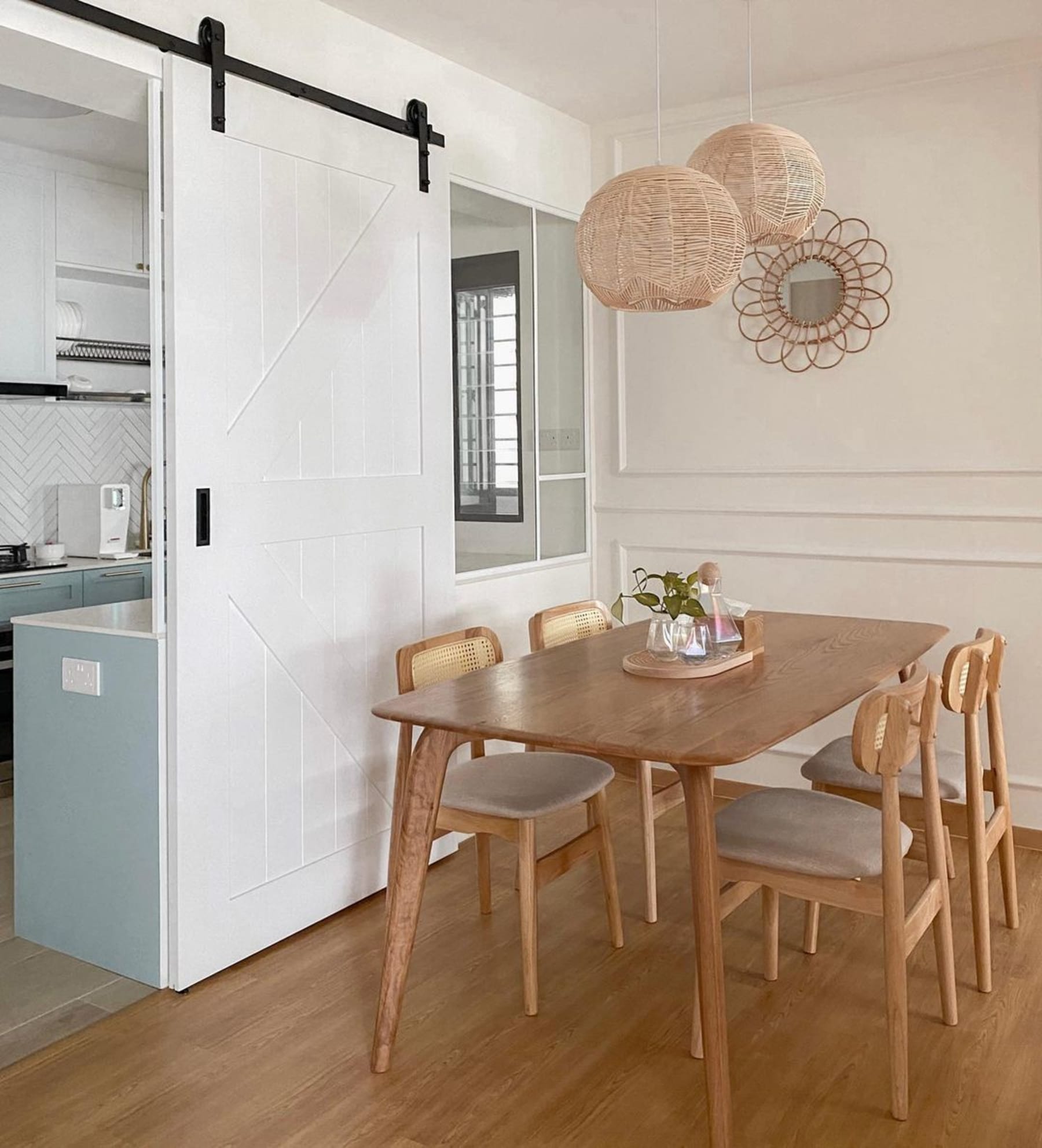 An oak dining table with complementing chairs.