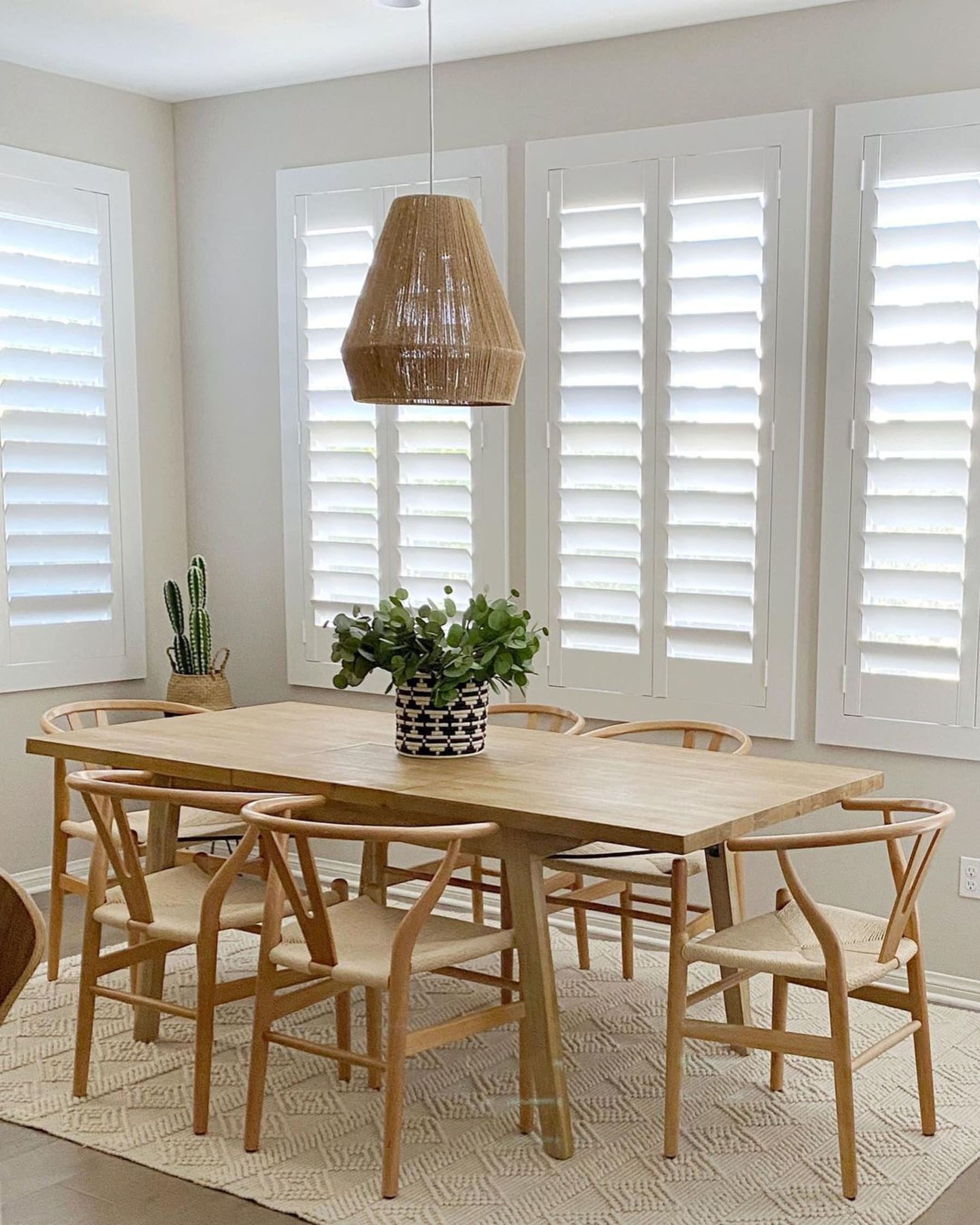 An extendable dining table with six complementing chairs.