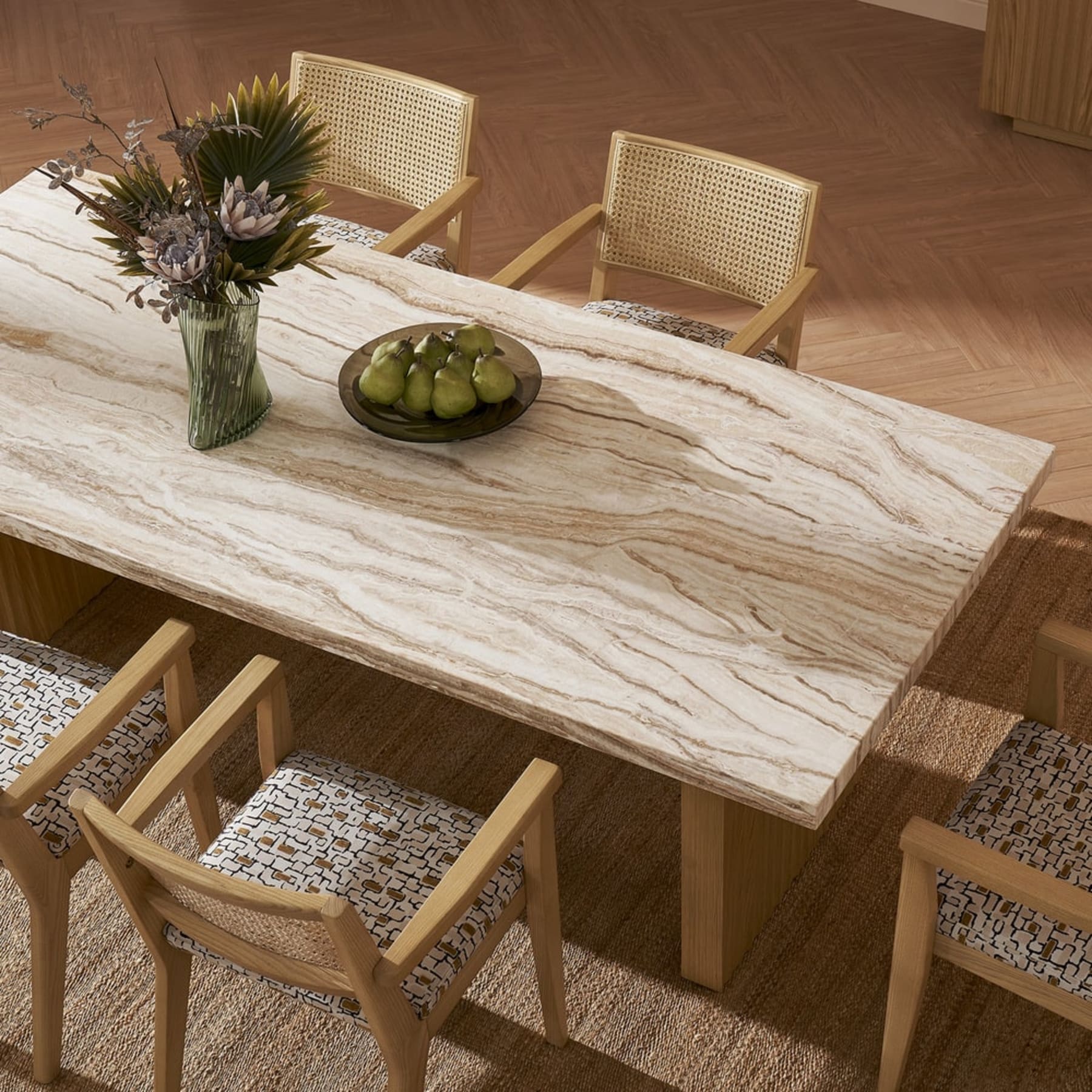 A marble dining table with grayish-brown veins.