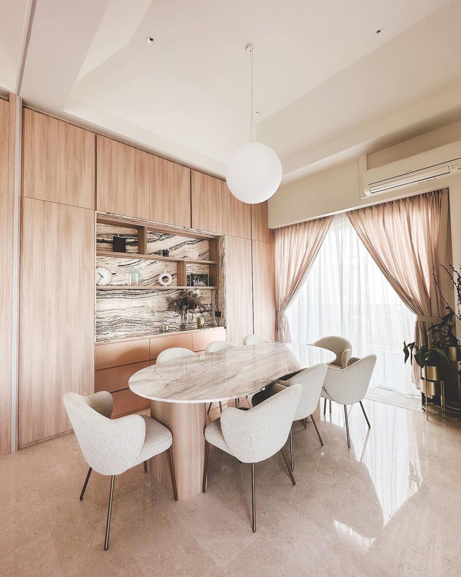 A marble dining table and 8 performance bouclé dining chairs.