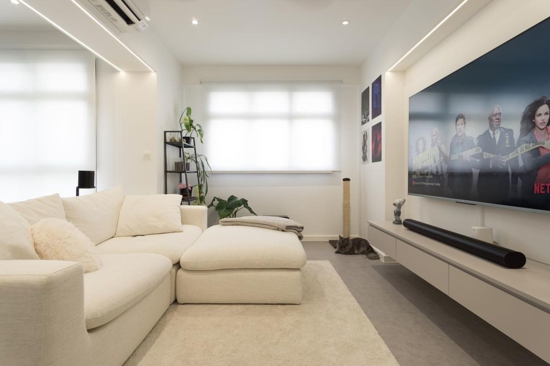 A white modular sofa and a white coffee table.