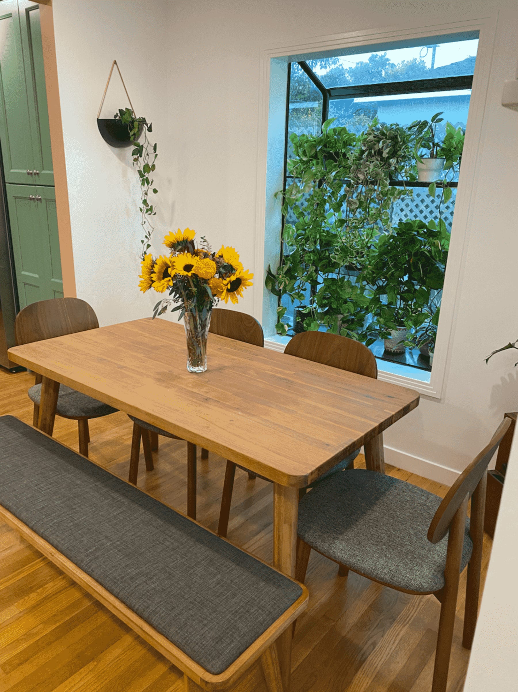 A dining room with shelves of potted plants