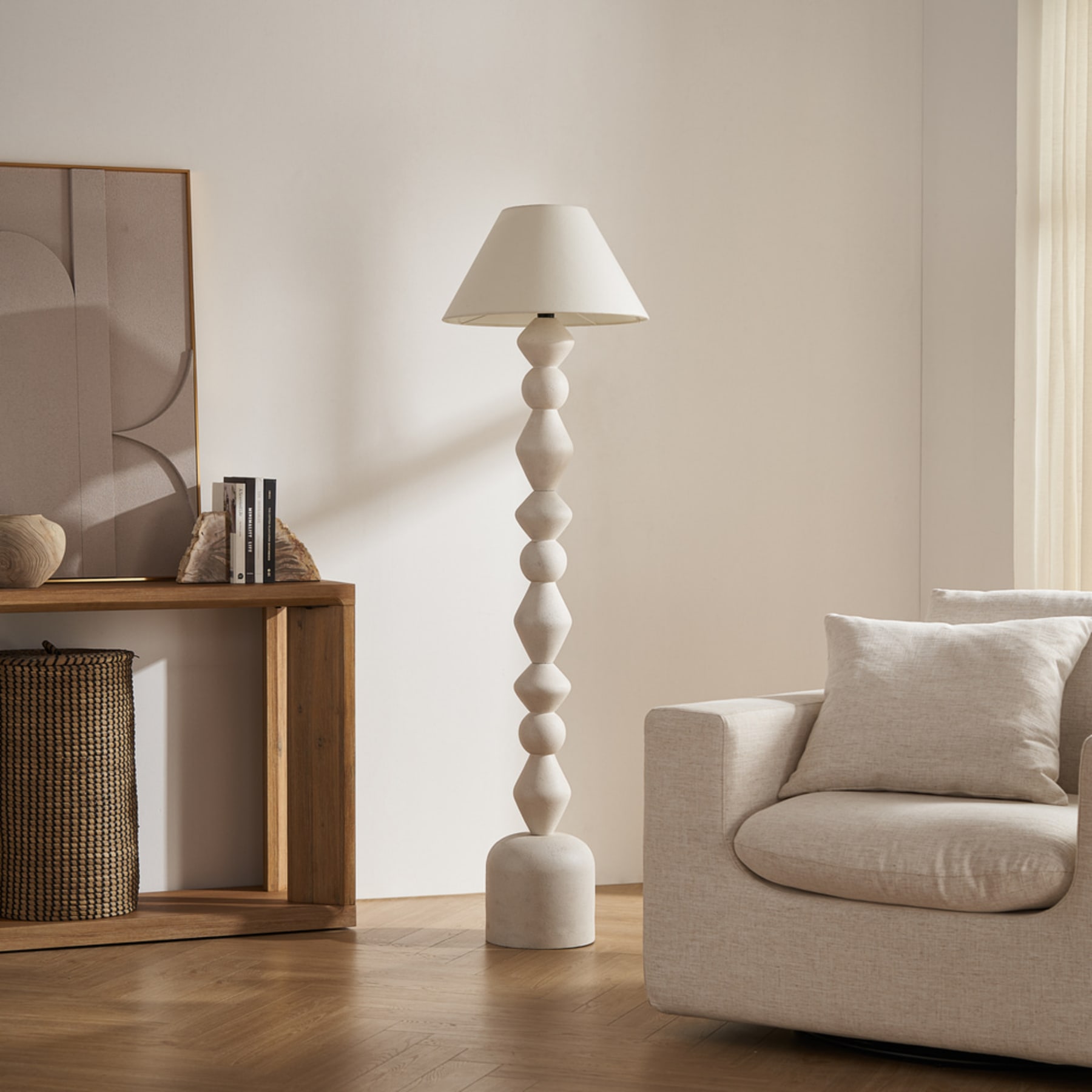 A floor lamp with a unique sculptural pillar.