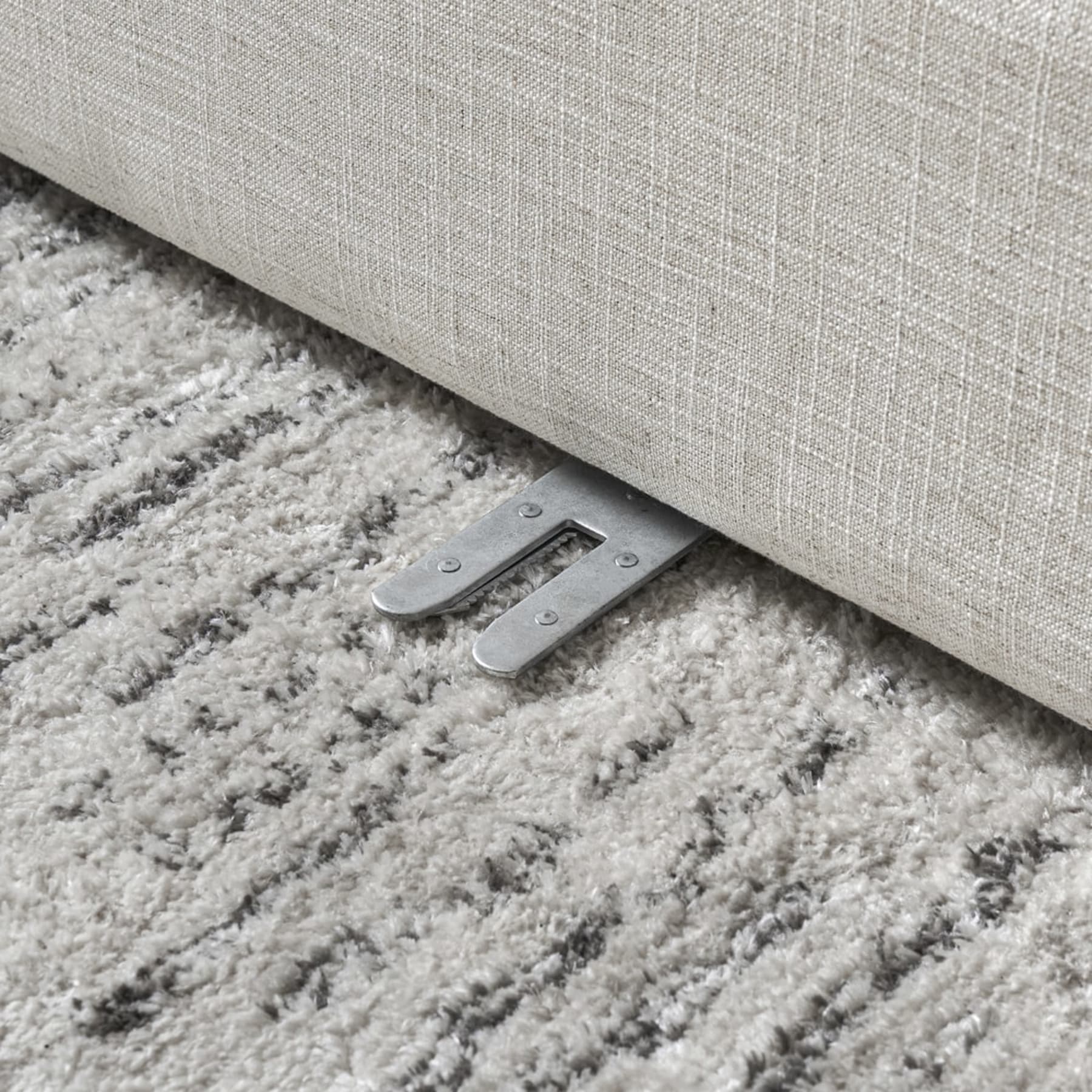 A close-up shot of an alligator clip of a modular sofa unit.